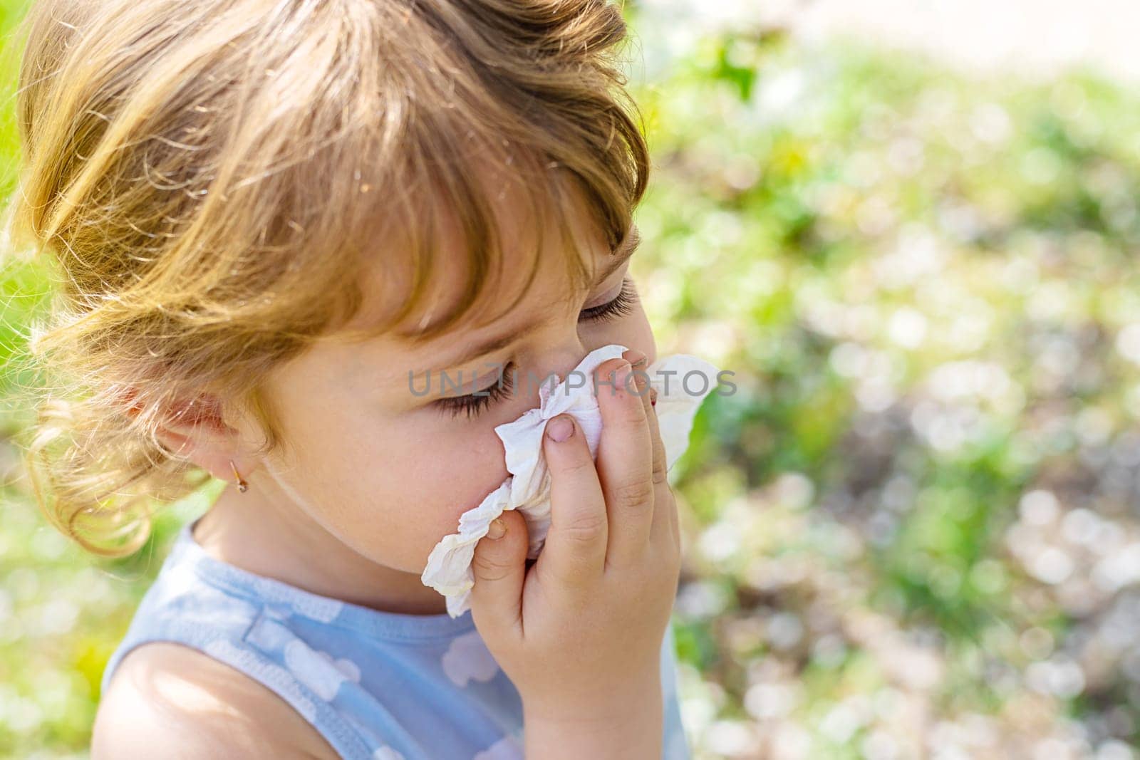 child allergic to flowering trees. Selective focus. kid.