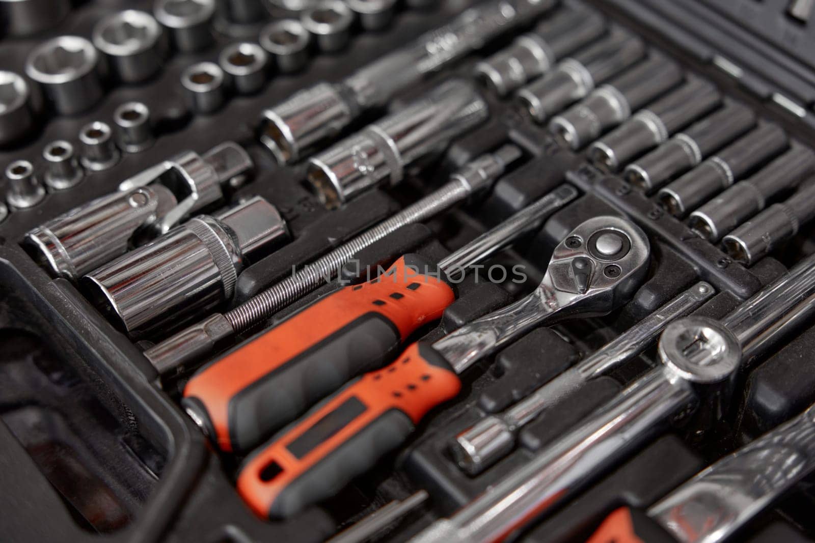 Closeup of tool box with kit of wrenches, screwdrivers, spanners and nuts for mechanic service. Hardware store assortment and great choice. Closeup selective focus of repairman instrument