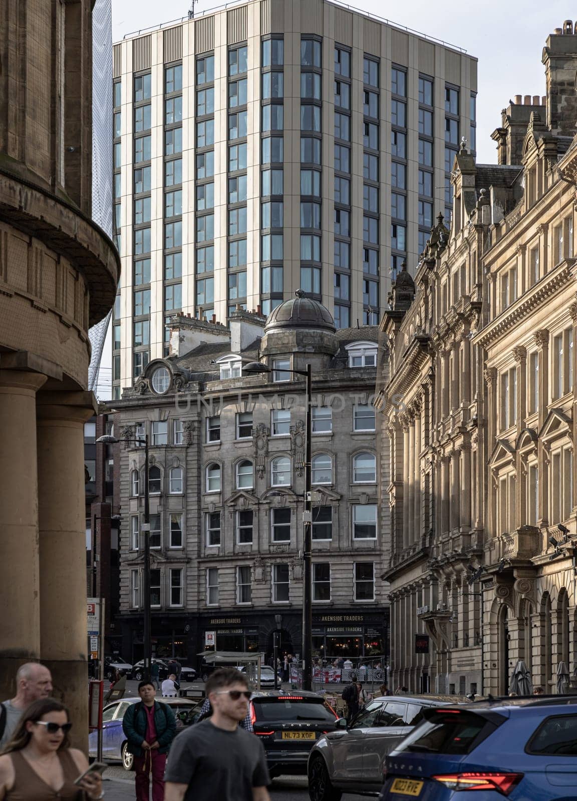 Newcastle, UK - Apr 11, 2025 - View of Akenside House with Cale Cross House in the background at Akenside Hill in the Quayside at Newcastle upon Tyne. High rise office block towering above older buildings, use it as your Wallpaper, Poster and Space for text, Selective focus.
