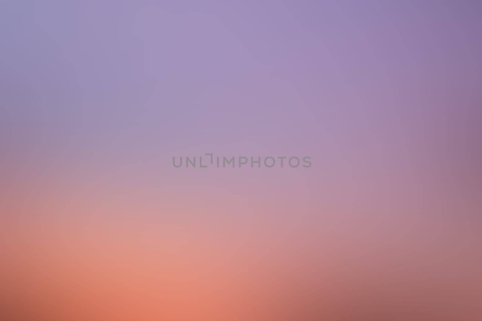 A beautiful gradient background featuring rich hues of purple and orange, reminiscent of a vibrant sunset painting the sky at twilight