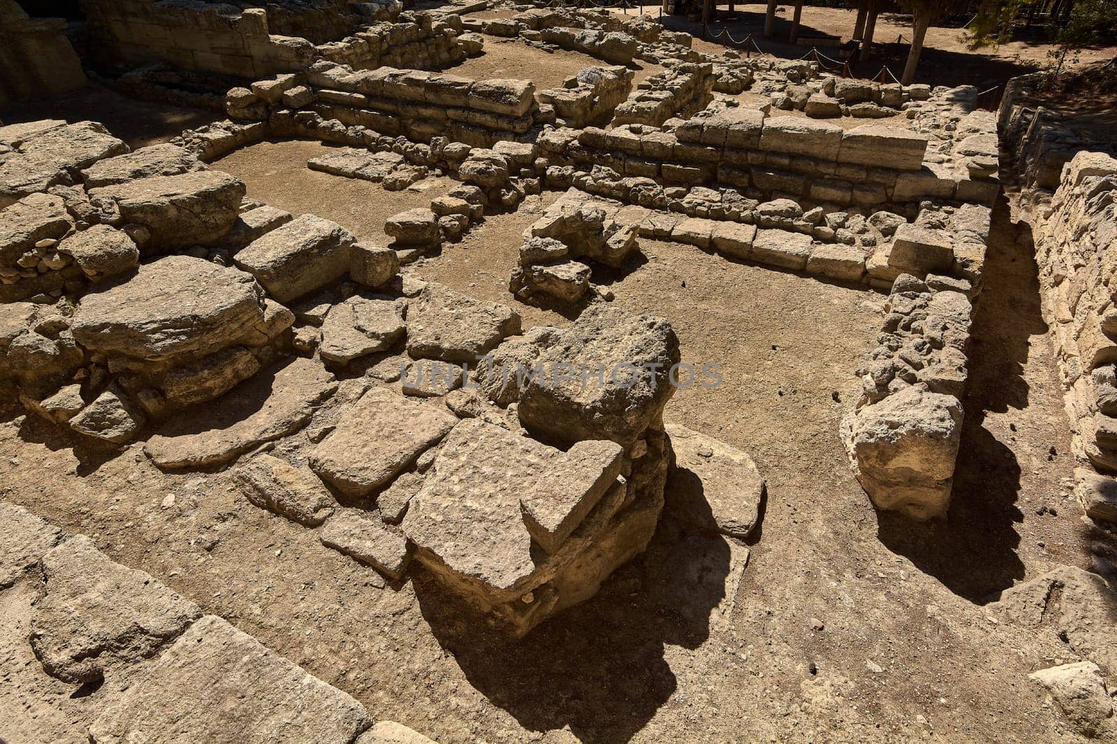This image captures the historical ruins of Knossos in Crete. The well-preserved stone foundations and walls highlight the ancient civilization's architectural prowess.