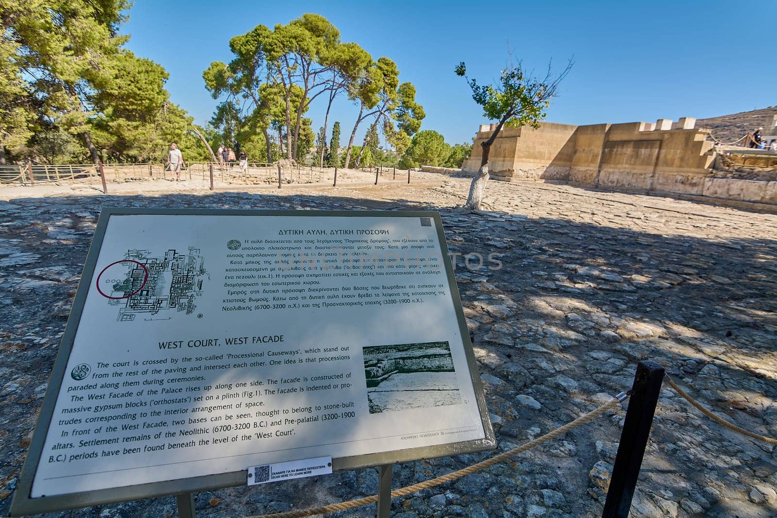 Crete.Greece - april 24, 2025: Informational sign at Knossos archaeological site, explaining the West Court and West Facade of the palace with historical facts, diagrams, and images.