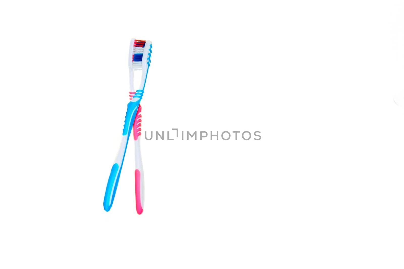 a small brush with a long handle, used for cleaning the teeth.