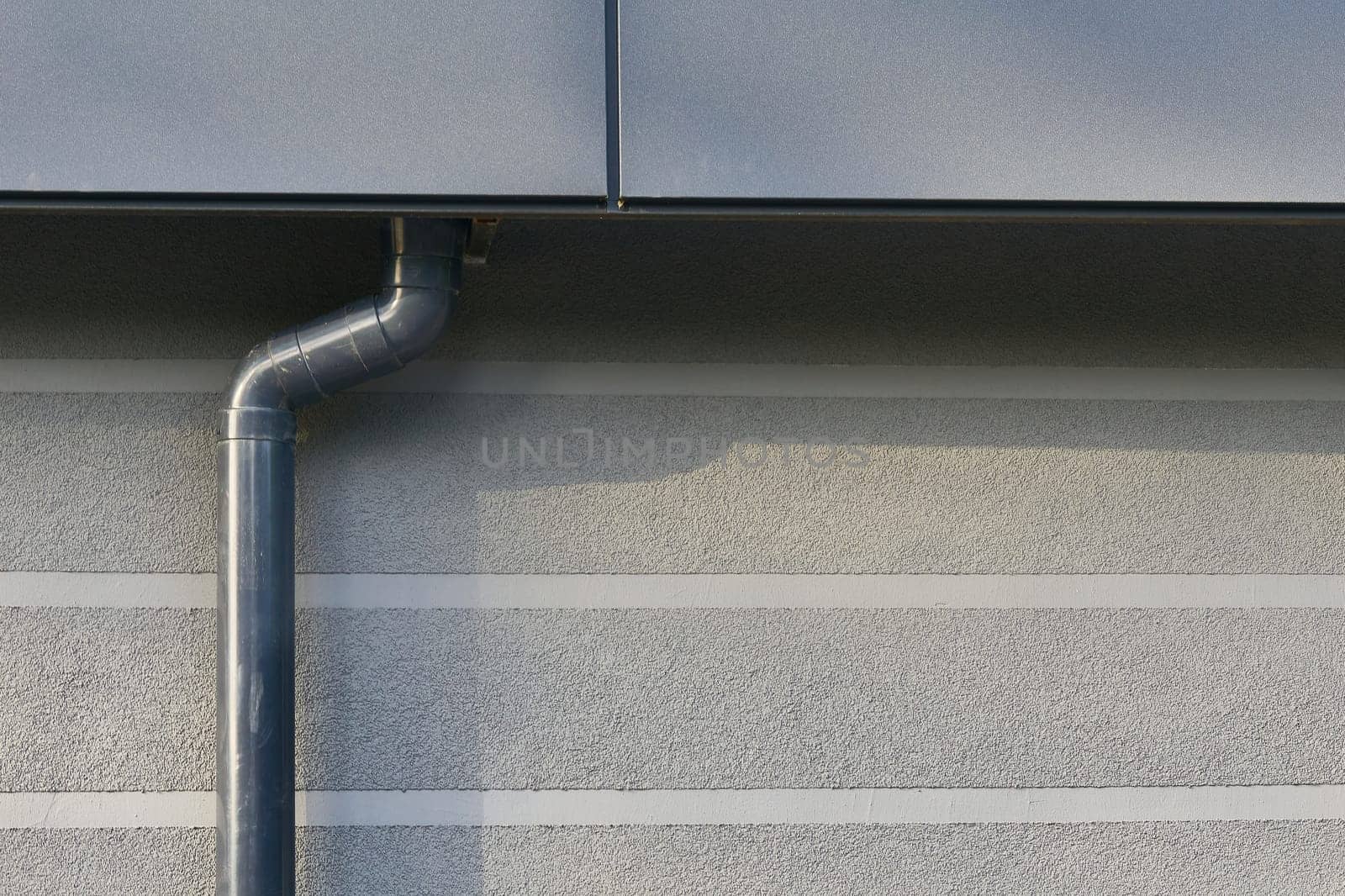 the draining away of water or substances carried in it, from the surface of an area of land