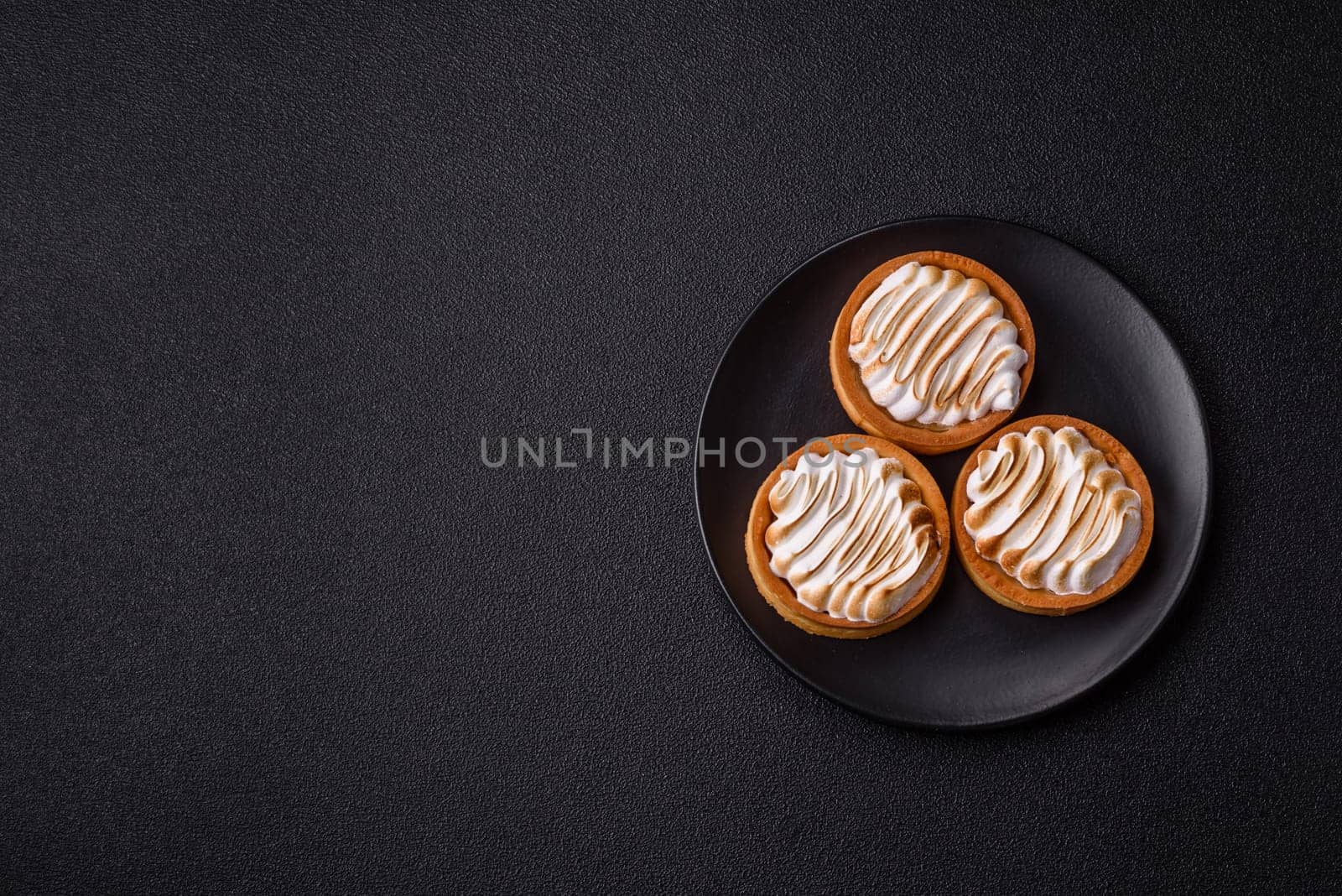 Lemon tart, meringue pie or fruit cream tart. Dessert, sweets for the morning table