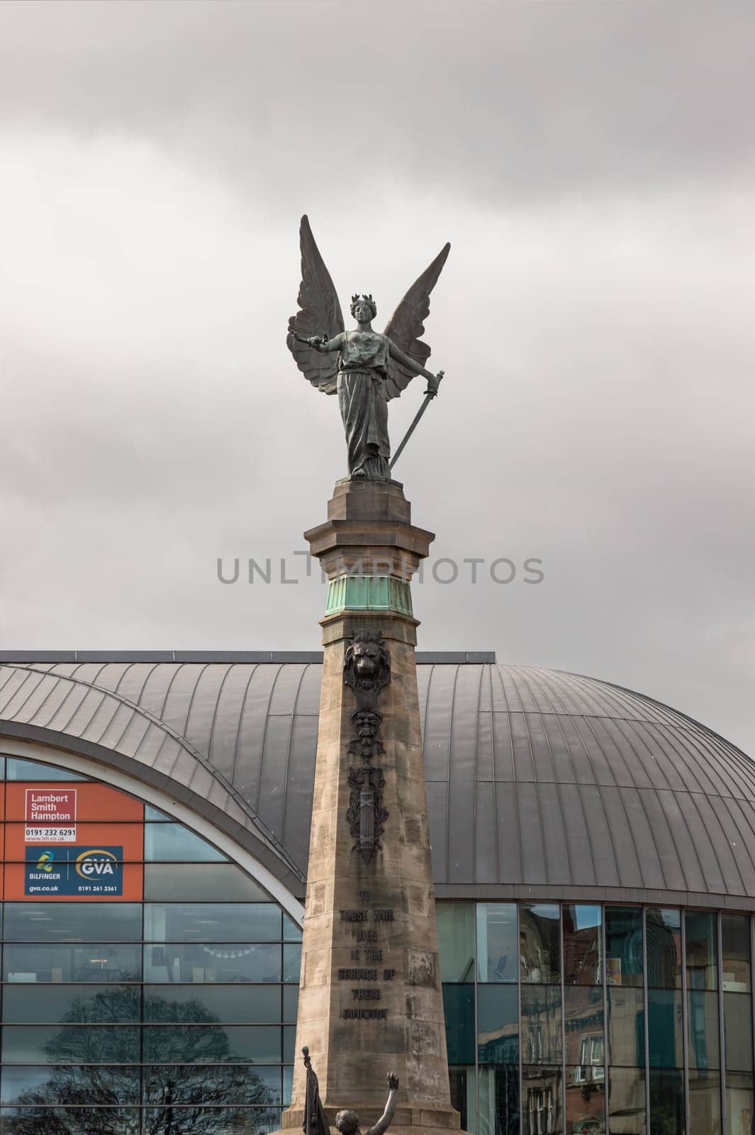 Newcastle, UK - Apr 14, 2025 - The South African War memorial with the Haymarket in the background. use it as your Wallpaper, Poster and Copy space, Selective focus.