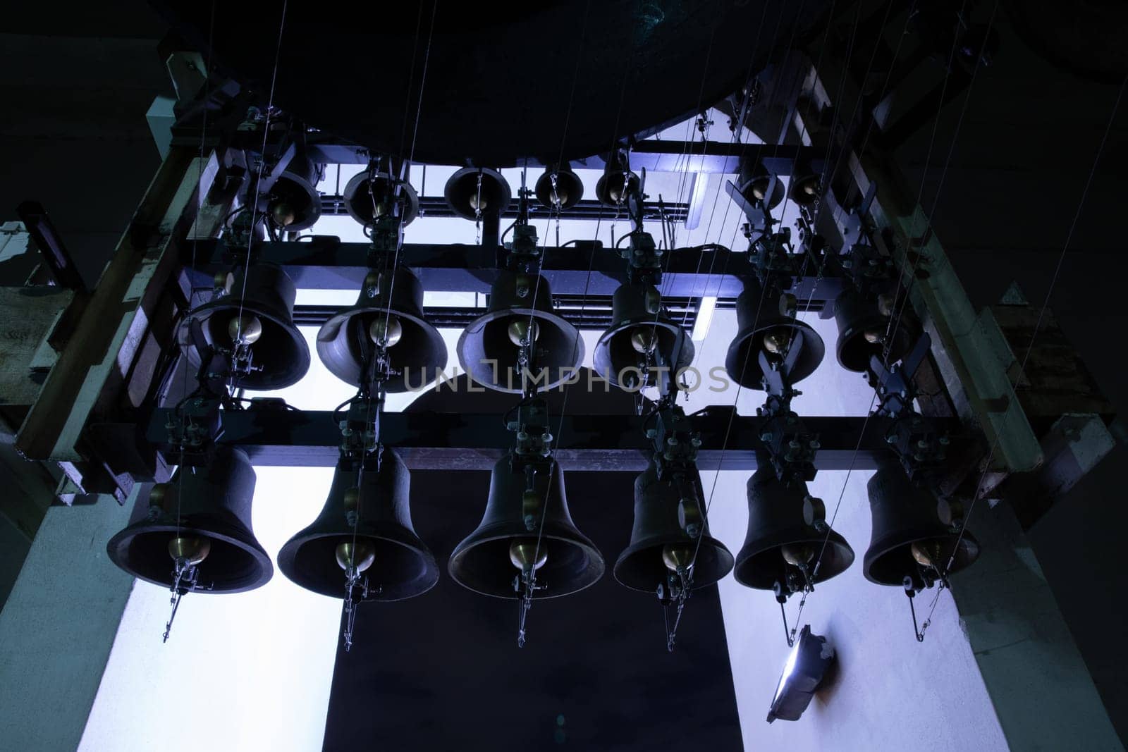 Various of bells inside of the bell tower of St. Michael's Golden-Domed Monastery at night. Orthodox Easter bells ringing. Kyiv, Ukraine.