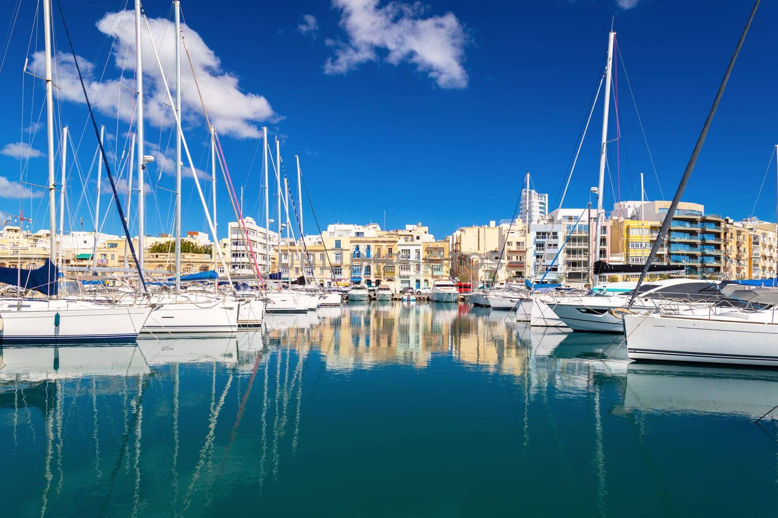 Beautiful cityscape of the Ta Xbiex bay with yachts lying on water, Malta