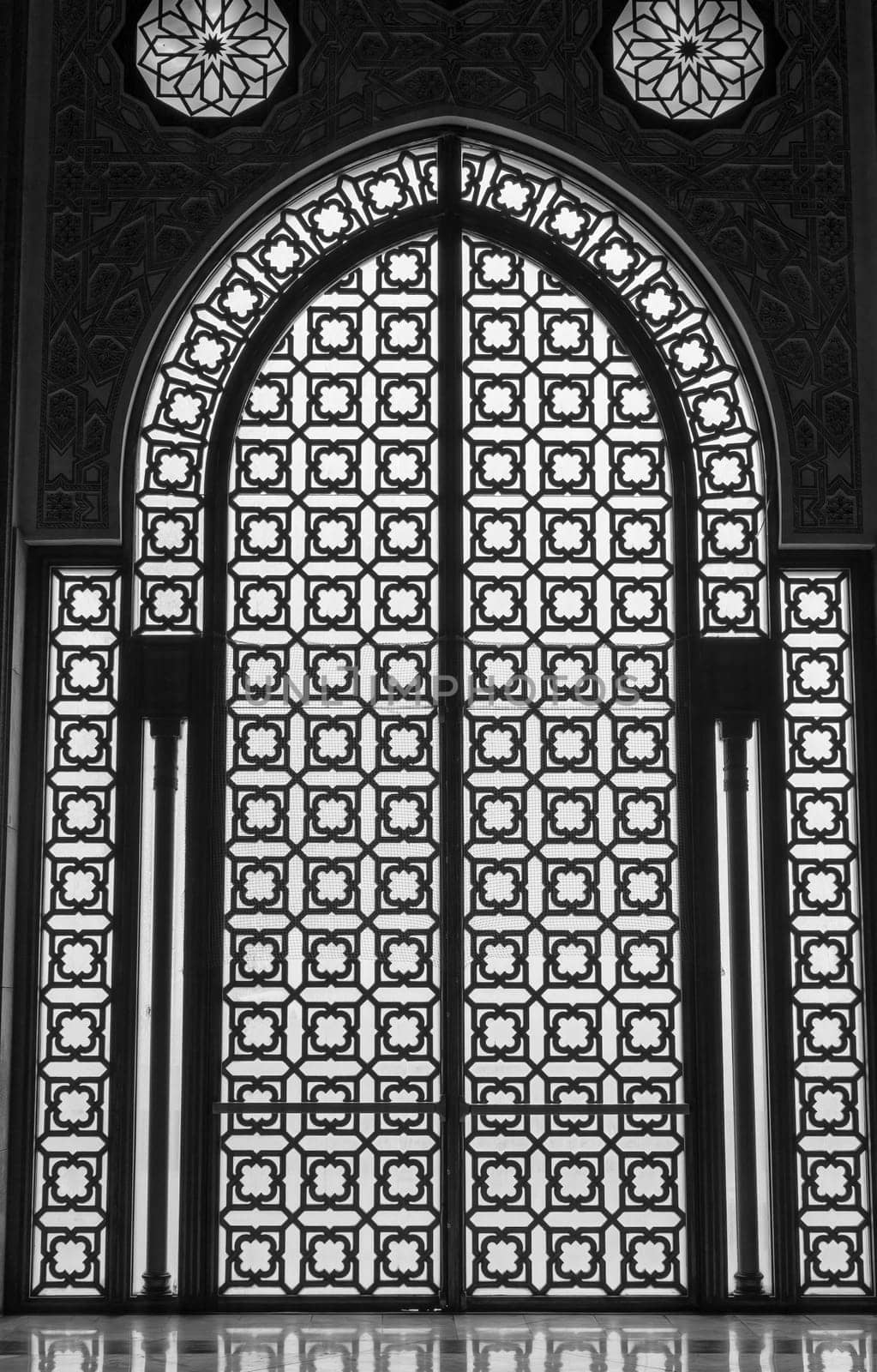Gate silhouettes at Hassan II Mosque - Casablanca, Morocco. Vertically. 