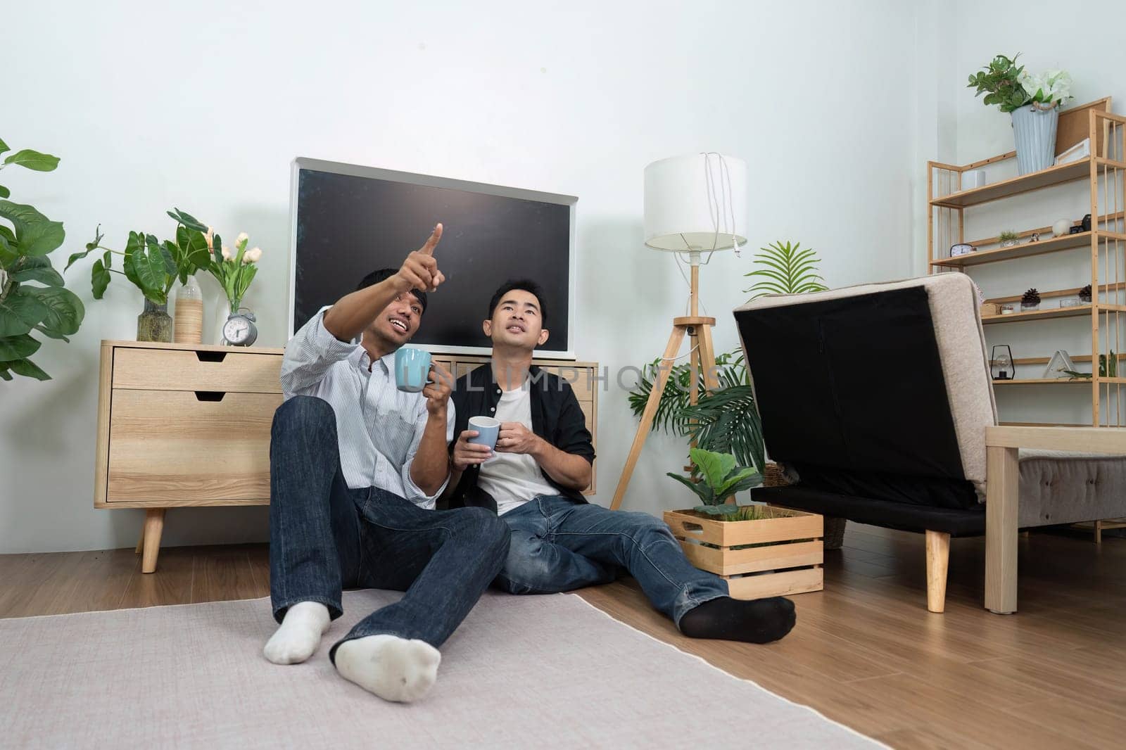 A loving couple enjoys a cozy evening together, sharing laughter and bonding over their favorite show in a warm, inviting living room.