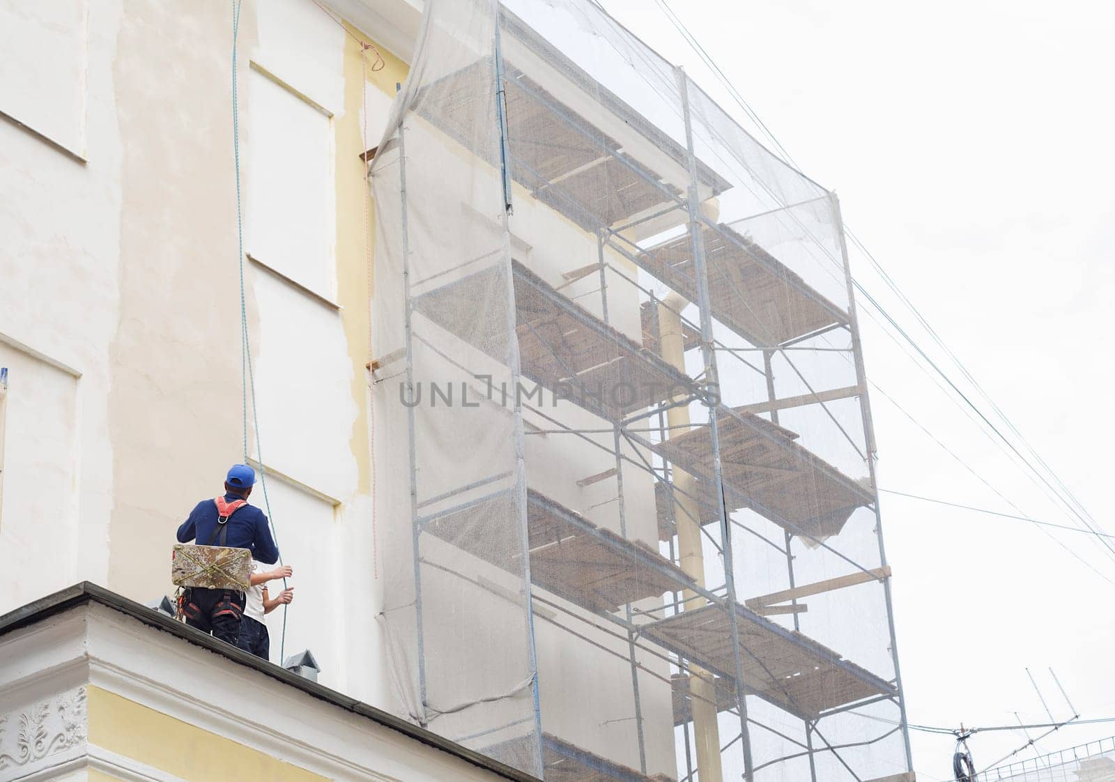 Worker at height on a building construction site