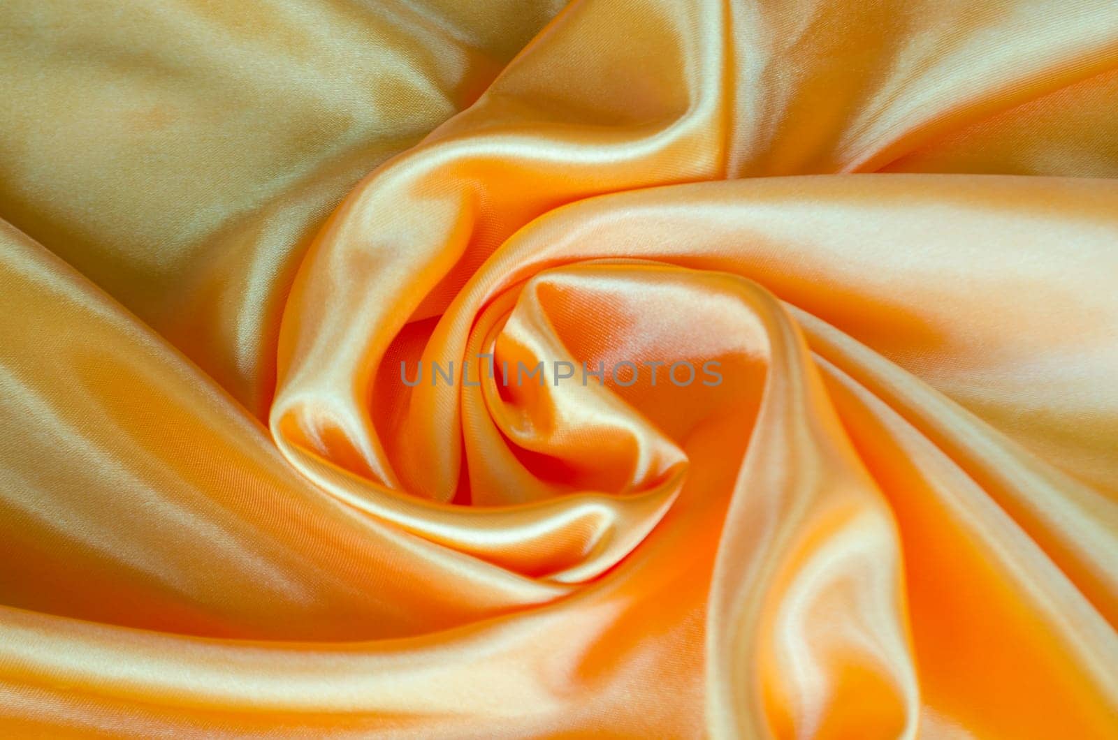 Golden yellow silk with silky sheen suitable for design and wallpaper background.
