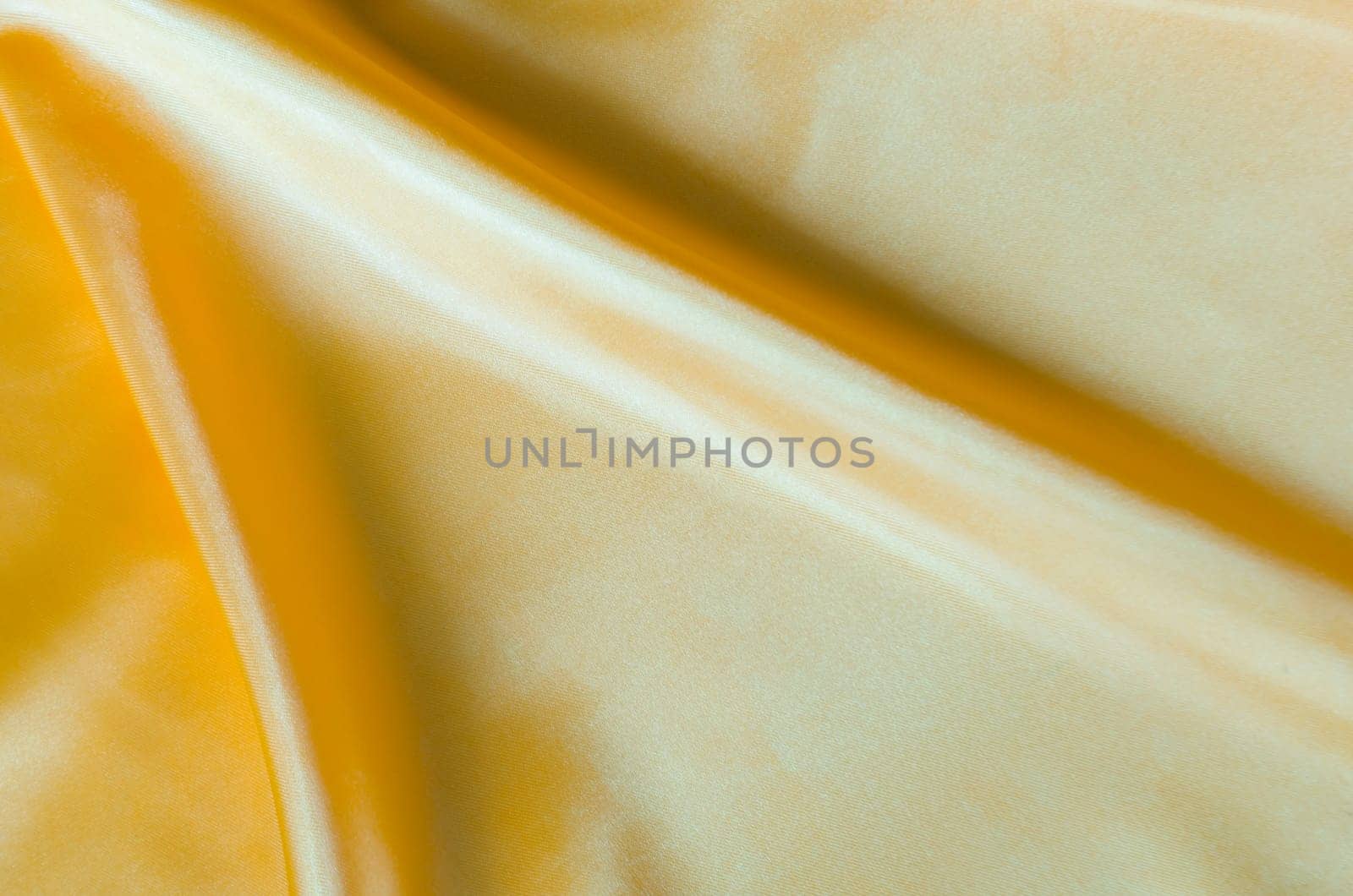 Golden silk cloth with silky sheen and beautiful natural draping.