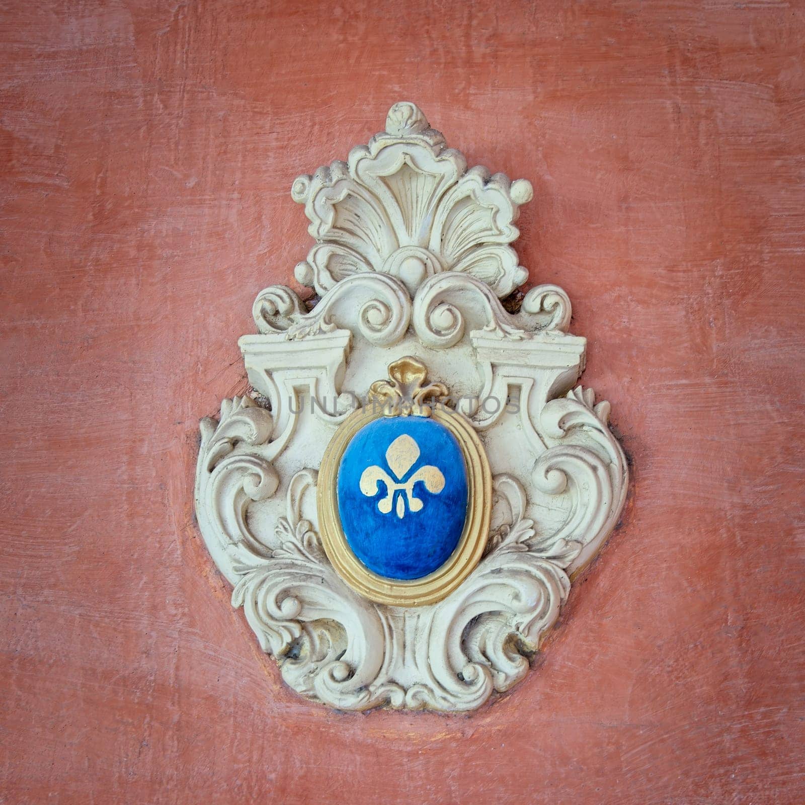 Exquisite wall motif located in Prince Naguib Sharkas Palace features a decorative emblem with a blue and white design. This elegant piece reflects historical artistry in Cairo, Egypt.