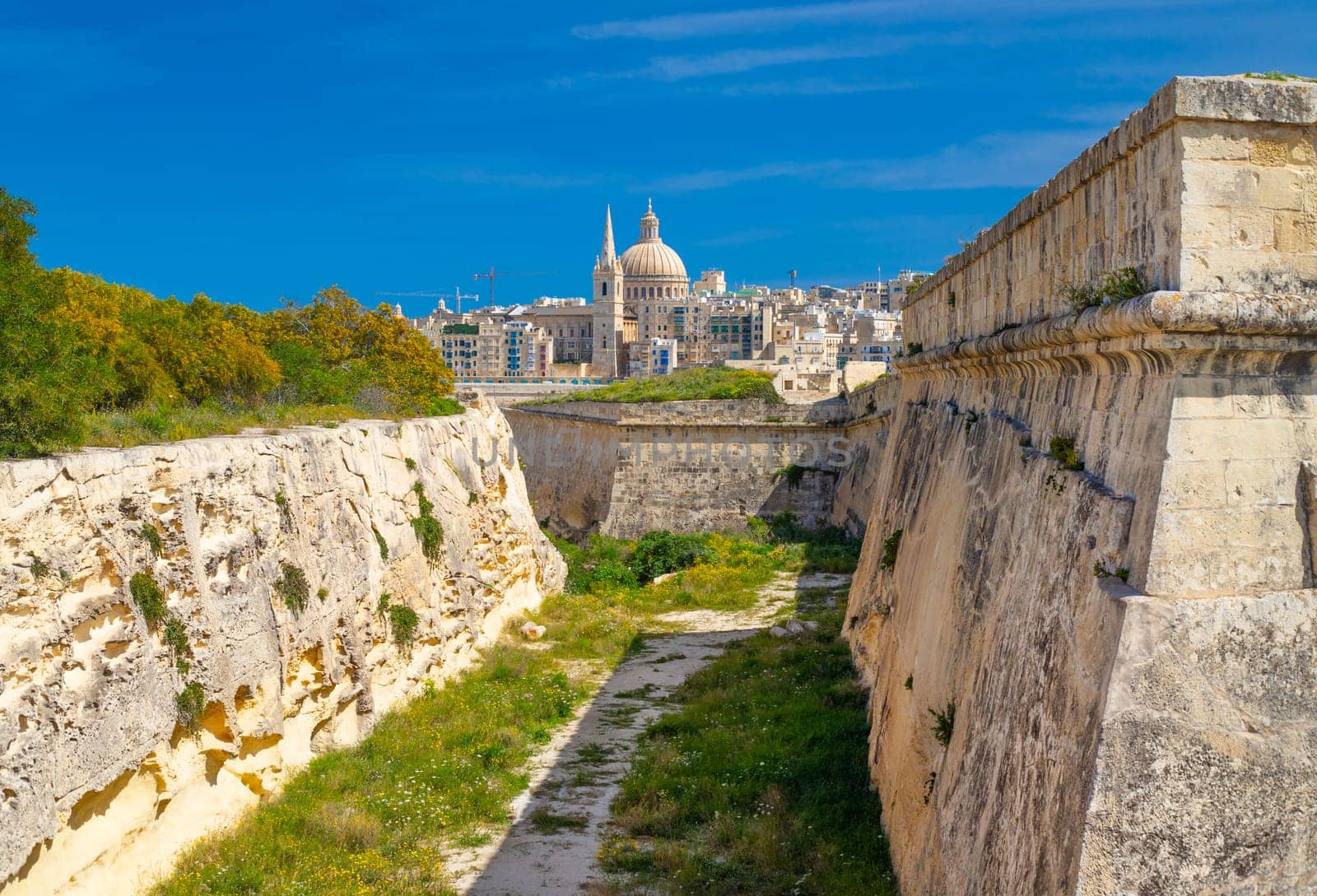 Beautiful view of Valletta through fortified walls of Manoel Island.