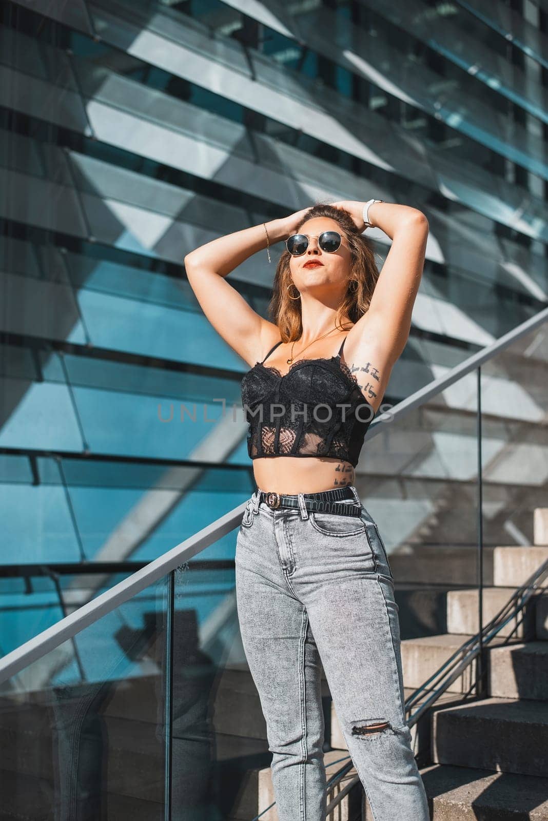 relaxed young woman enjoying sun in the city