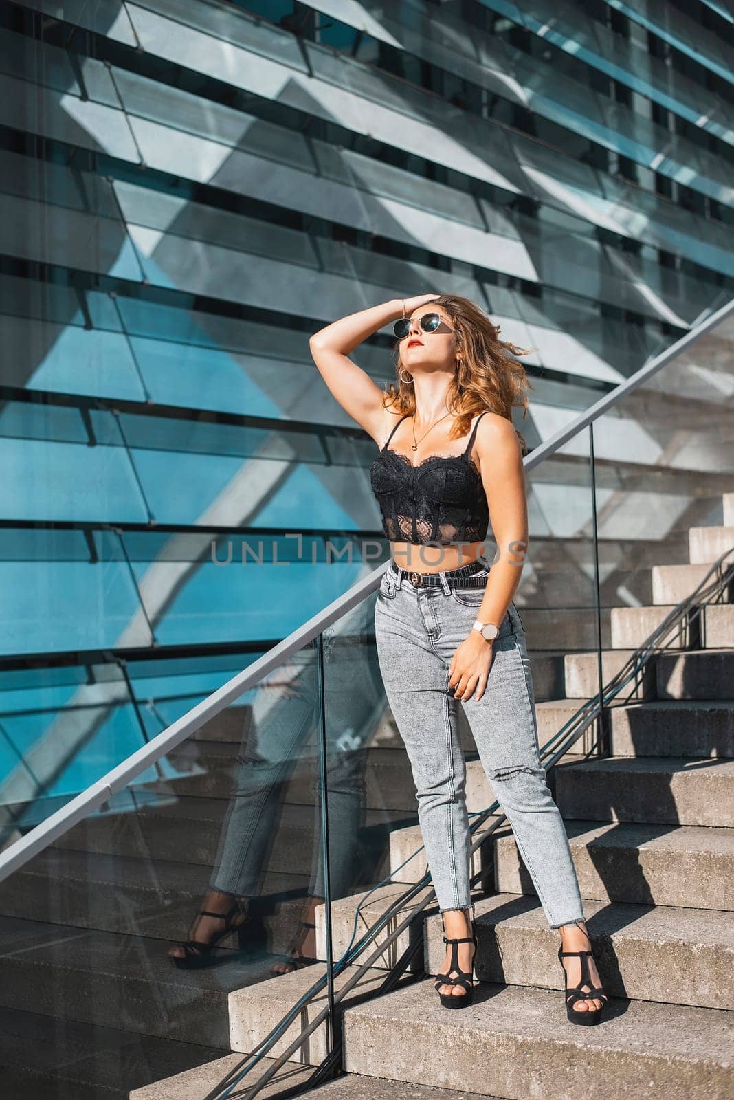 relaxed young woman enjoying sun in the city