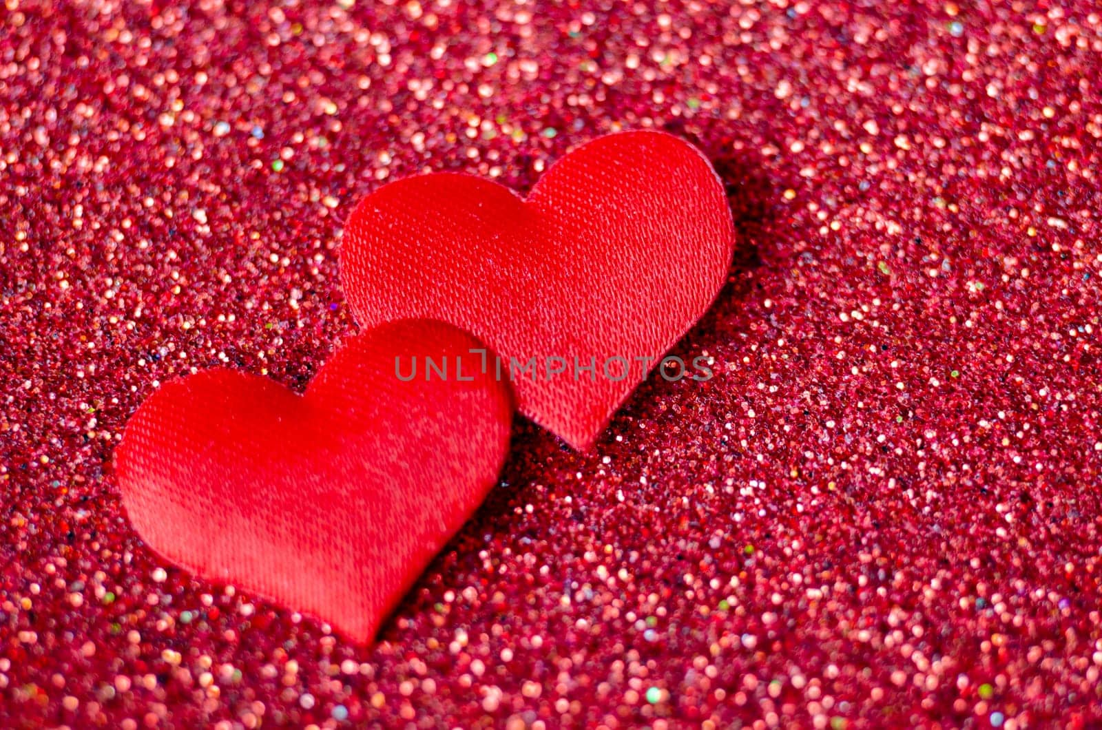 Tiny red hearts on sparkle red background with customizable space for text or wishes.
