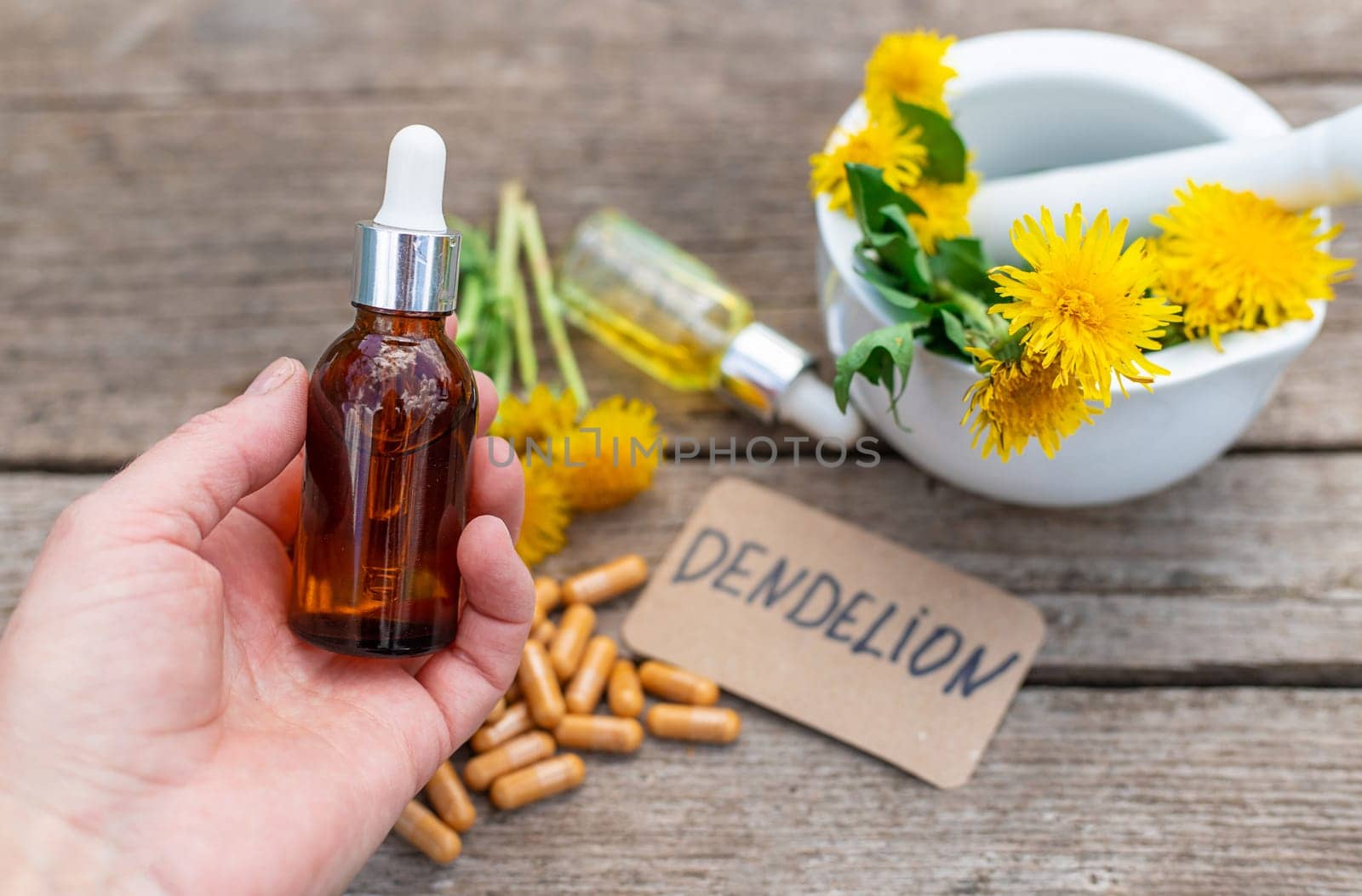 Dandelion extract and homeopathic supplements. Selective focus. nature.