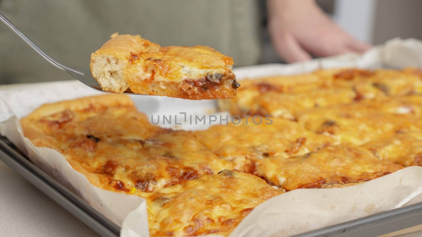 Homemade square pizza with cheese and sausage topping served on wooden table Square pizza, full cheese spread organic pizza healthy pizza.