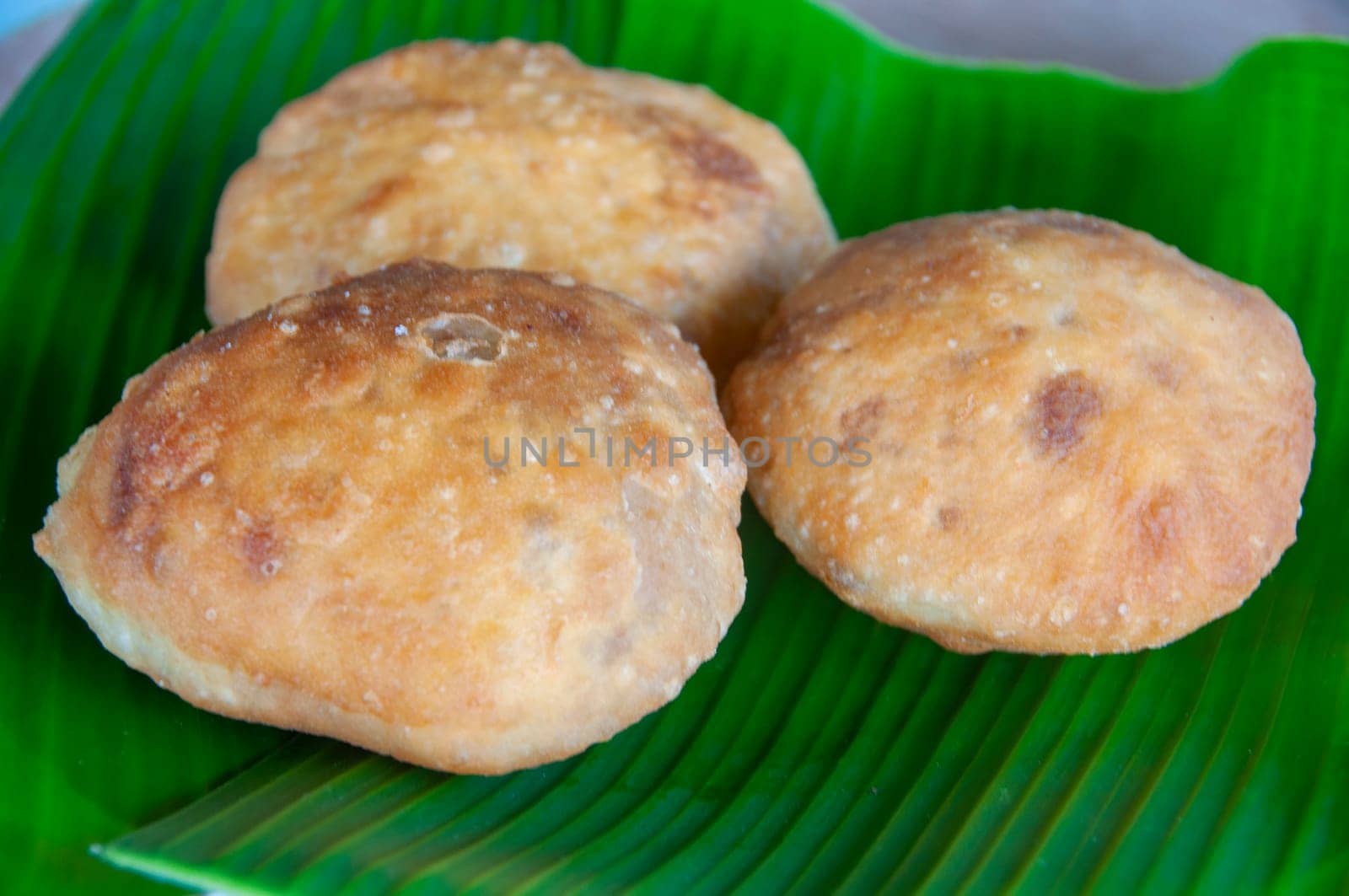 Side view of North Borneo home made traditional green bean cake with banana leaf background. Asian food concept.