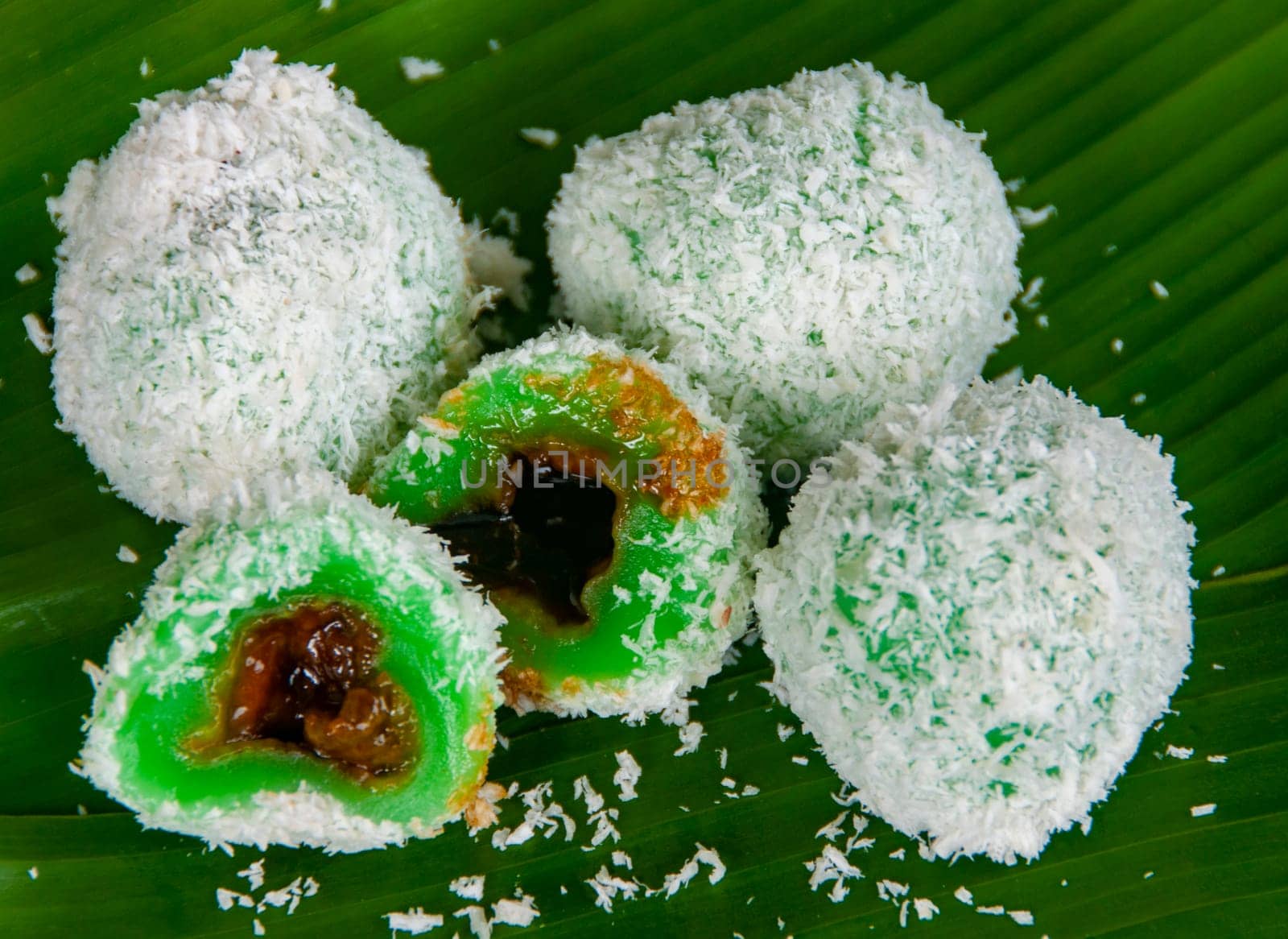 Top view of delicious traditional onde onde with gula melaka filling and coconut coating.