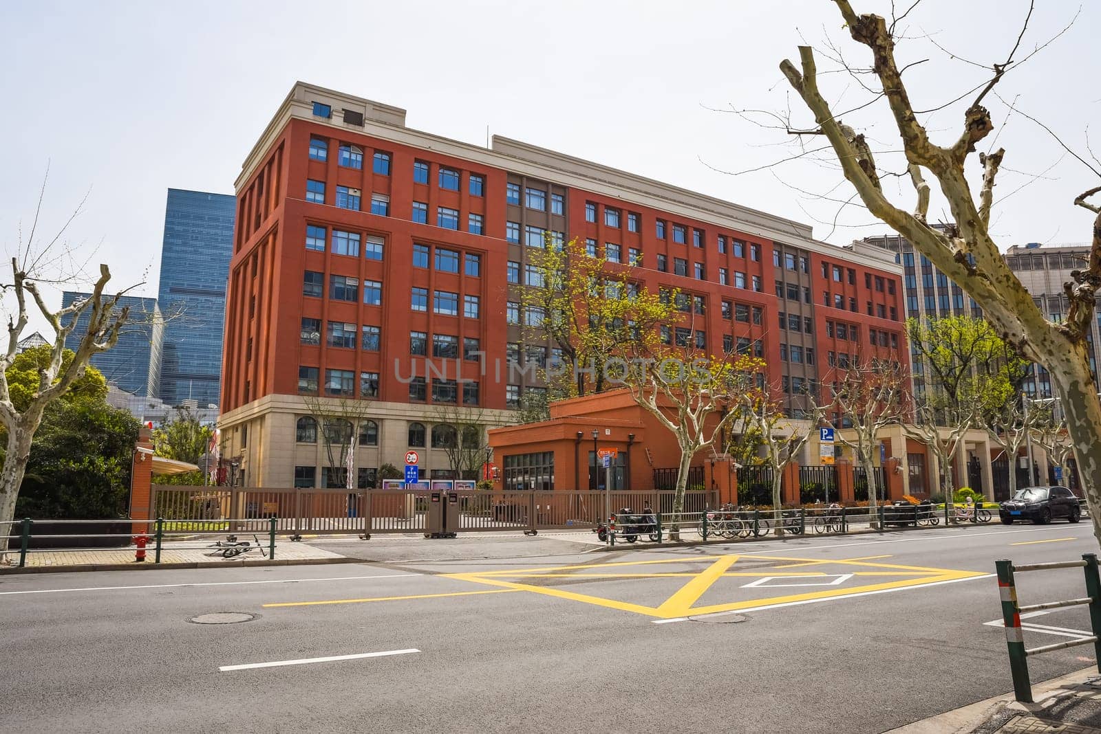 Shanghai, China - 1 April 2025: East China Normal University Dongchang High School in Pudong. Modern academic building with students walking
