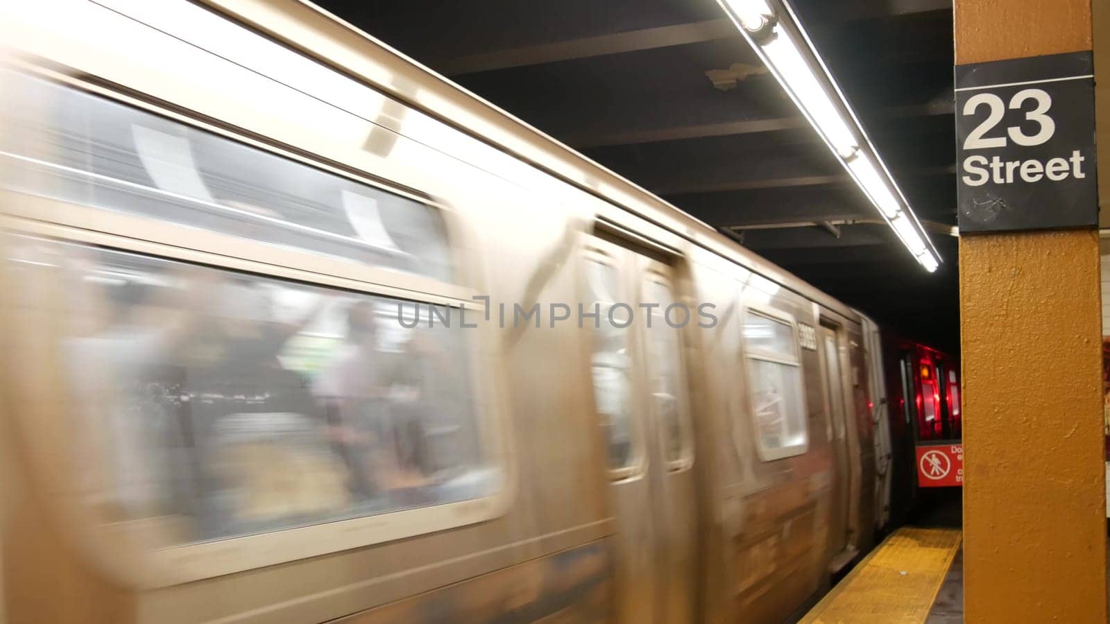 New York City, United States - 30 Aug 2023: Subway station interior, underground metropolitan platform sign. Metro railway passenger public transport. Text signboard: 23 Street. Midtown Manhattan, NYC