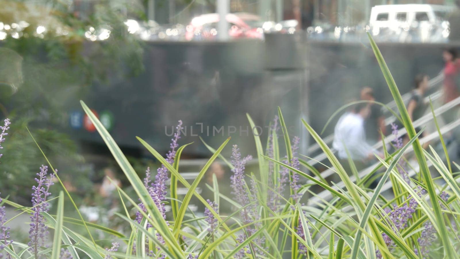 New York City, United States - 11 Sept 2023: Manhattan Midtown Lexington avenue, United States. Defocused people pedestrian, underground metro subway station, stairs on 53 street, urban USA. Greenery.
