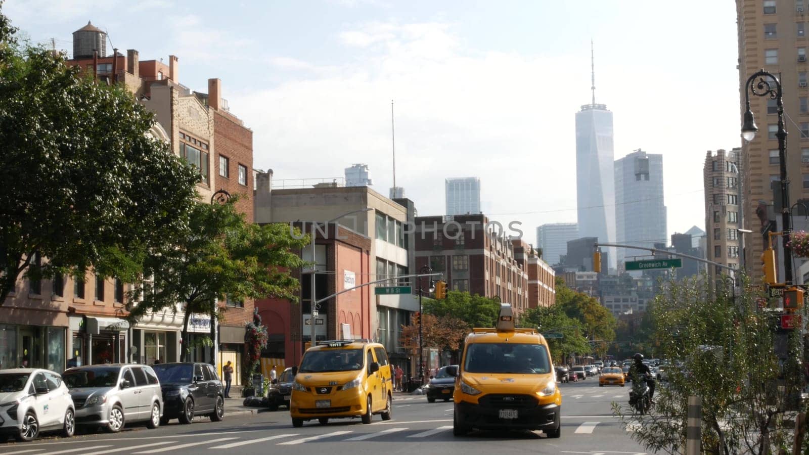 New York City, United States - 10 Sept 2023: Manhattan Greenwich Village street, Sixth 6 Americas avenue crossroad. Urban road car traffic in USA. People, zebra, yellow taxi cab. World trade center.