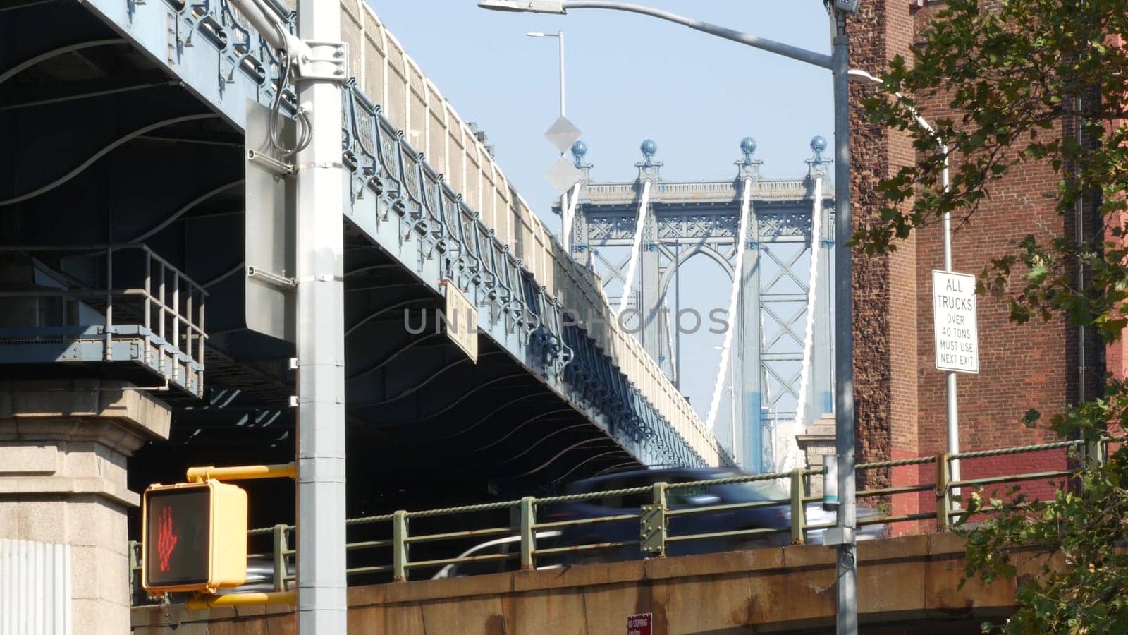 New York City, United States - 7 Sept 2023: Traffic road under Manhattan Bridge in Brooklyn. Cars on street, transport intersection in Dumbo. Vehicles below bridge on Brooklyn - Queens expressway.