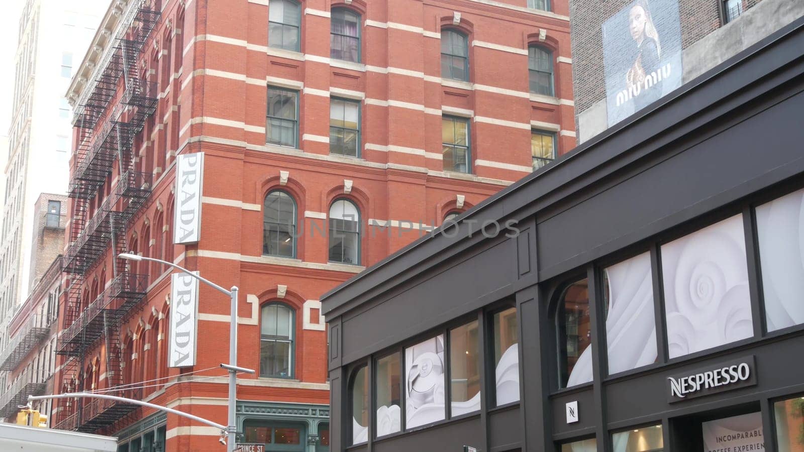 New York City, United States - 8 Sept 2023: Manhattan Soho fashion district near Broadway street, USA. Shopping boutique stores in NYC. Business and residential real estate. Prada, Miu Miu, Nespresso.