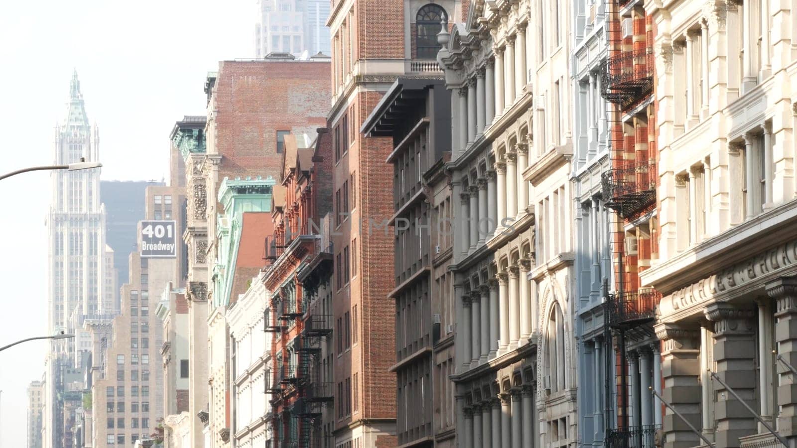 New York City, United States - 8 Sept 2023: Manhattan Soho fashion district, Broadway street. USA urban old classic american architecture, NYC. Business and residential real estate. Woolworth building