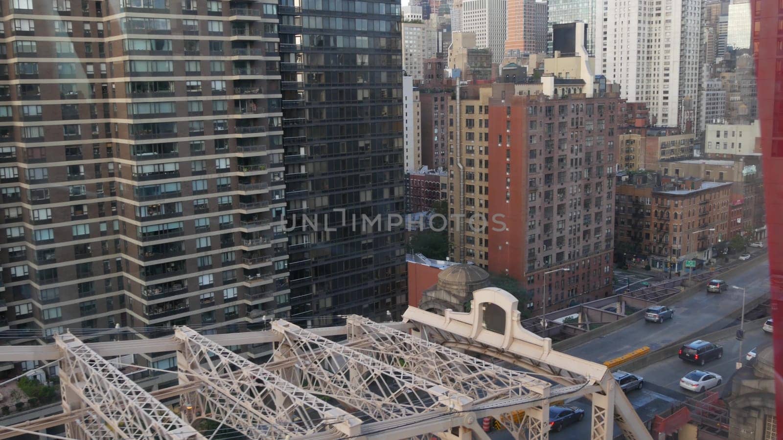 New York City, United States - 15 Sept 2023: Roosevelt Island tramway to Manhattan Midtown streets. American cable tram, Queensboro Bridge. Urban public transport, USA. Building architecture cityscape