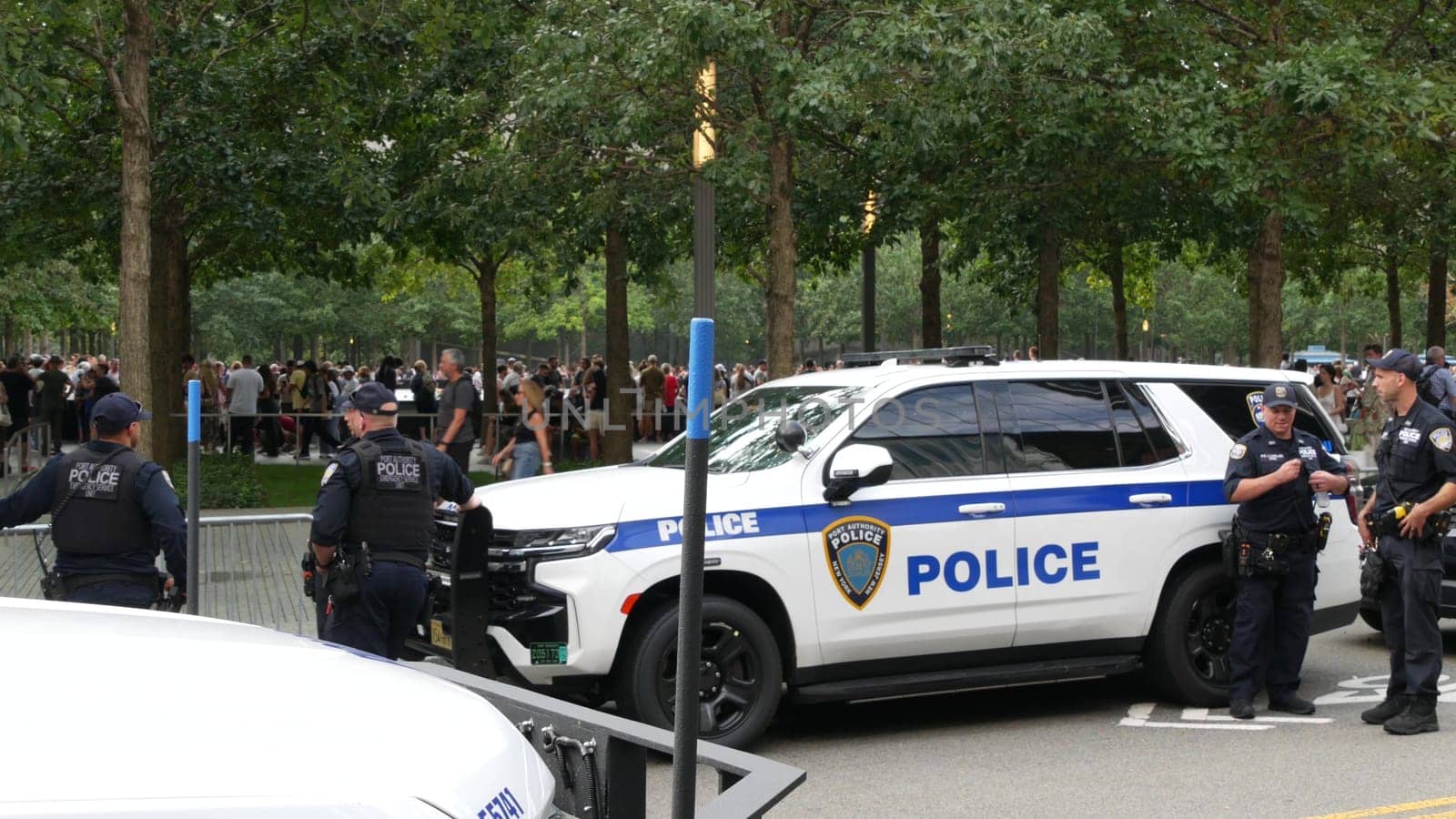 New York City, United States - 11 September 2023: Firefighters celebrate Patriot Day. Police cars, officers near 911 Memorial Pools. NYPD near Fire Department Station, Manhattan 10 Ten Firehouse, USA.