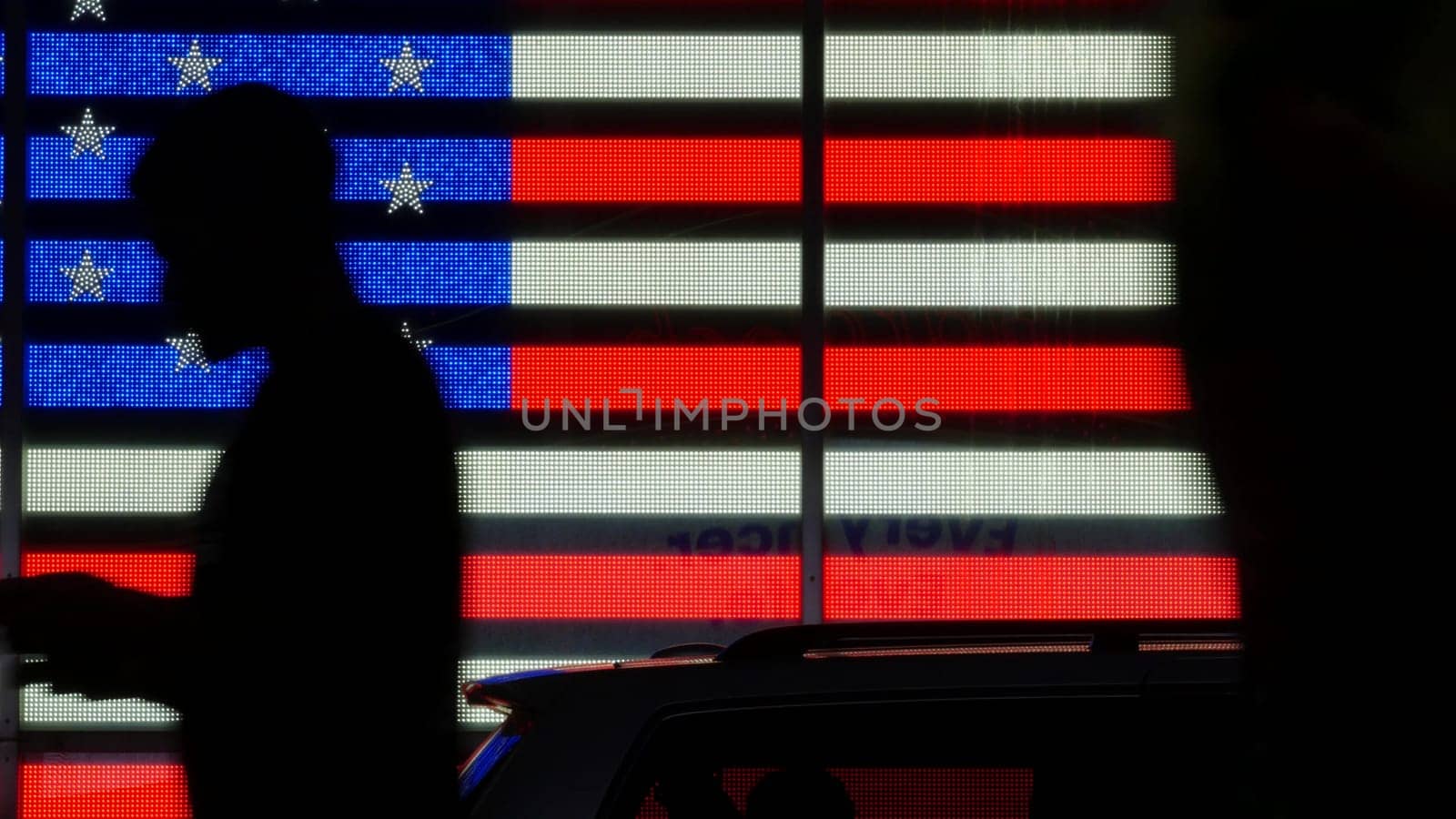 New York City, United States - 5 Sept 2023: Times Square, Manhattan Midtown Broadway street, USA. American flag, NYC urban life. Military island, army recruiting. People pedestrians silhouettes, crowd