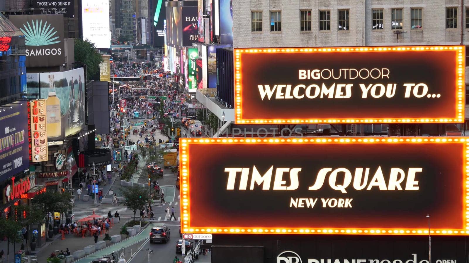 New York City, United States - 14 Sept 2023: Times Square, Manhattan Midtown Broadway street, USA. American NYC urban road traffic, people from above. Commercial illuminated billboard screens glowing.