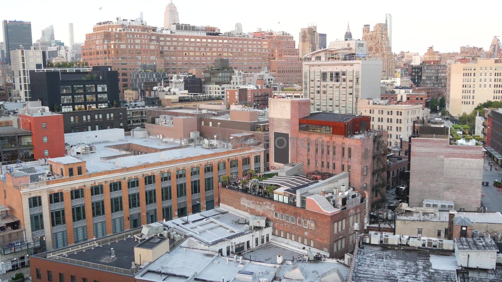 New York City, United States, 2 Sept 2023: Manhattan skyline cityscape. Empire State building. Rooftop, residential district roof. Real Estate architecture. Midtown Chelsea. Google headquarters office