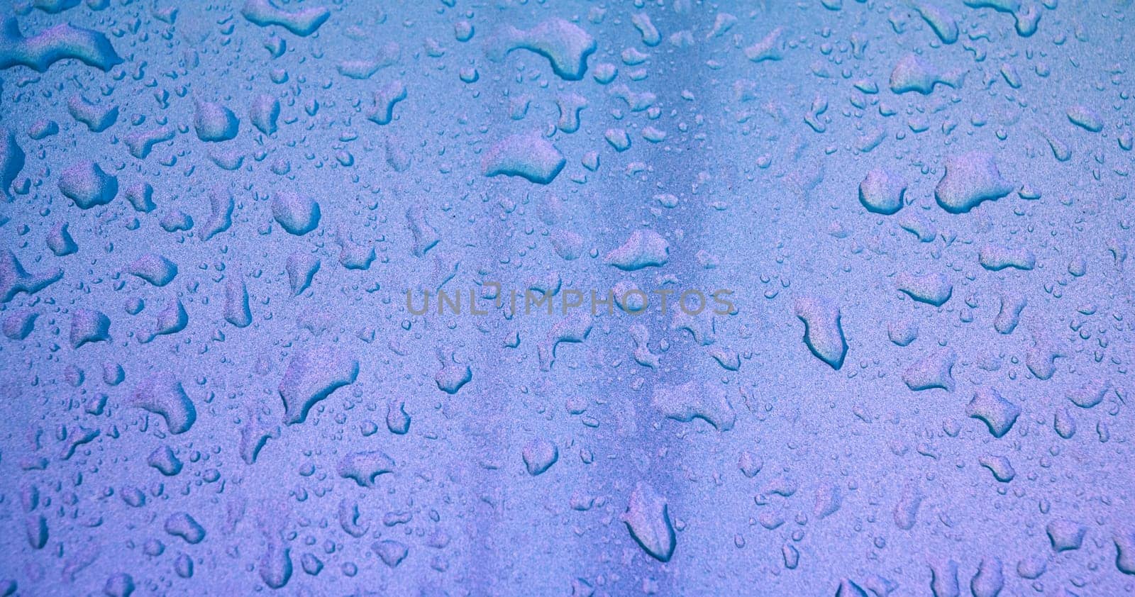 shiny pearl background with texture of rain drops on a metallic surface close-up