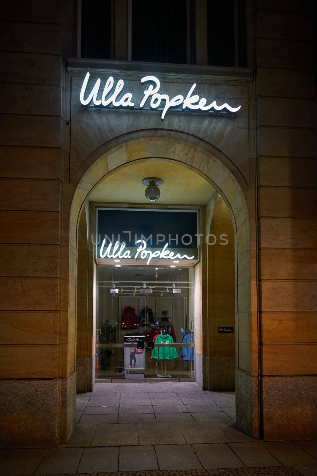 Dresden, Germany – January 17, 2025: Store of the german fashion company Ulla Popken, supplier for plus sizes in the city center of Dresden at night
