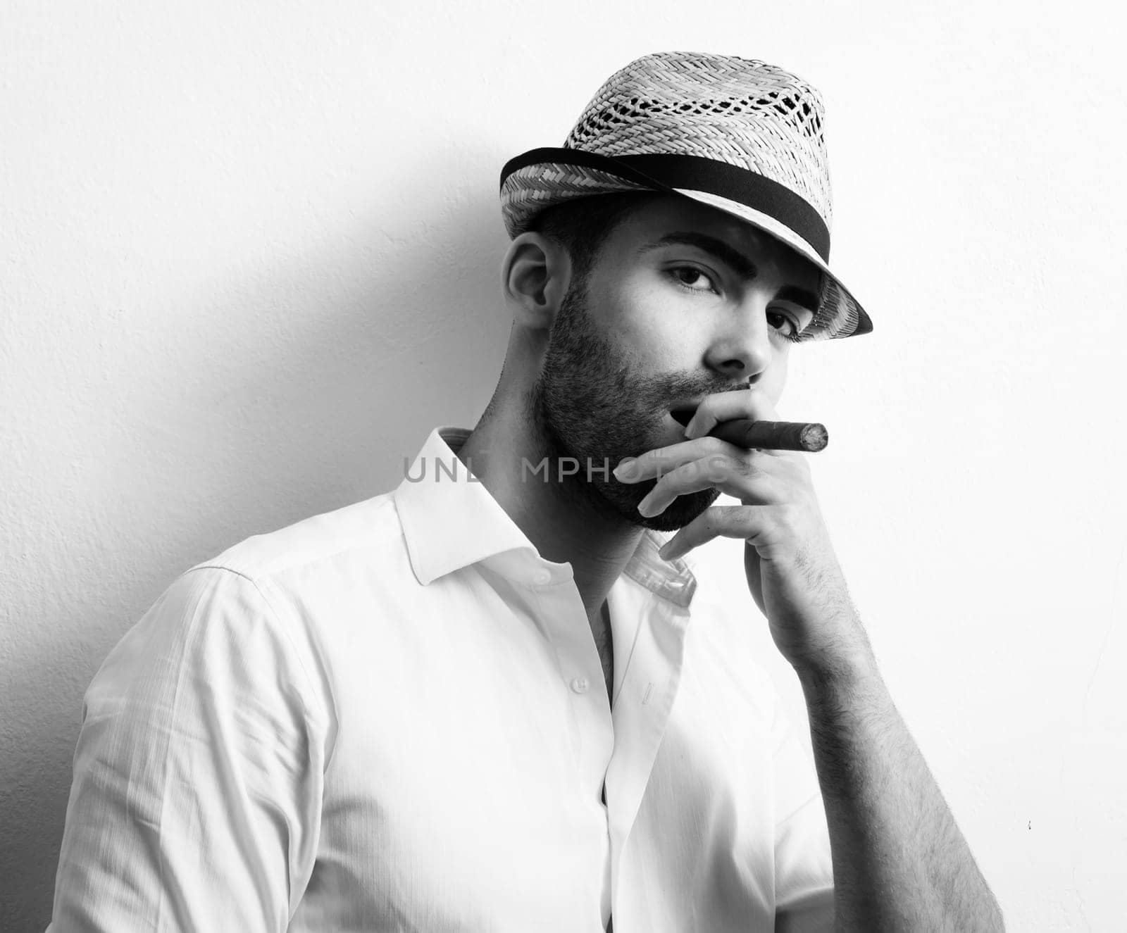 Young man smoking a cigar