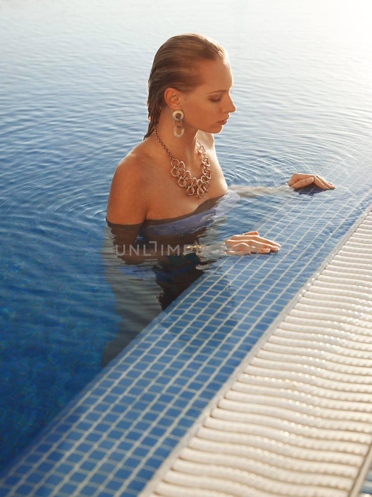 Girl relaxing in swimming pool