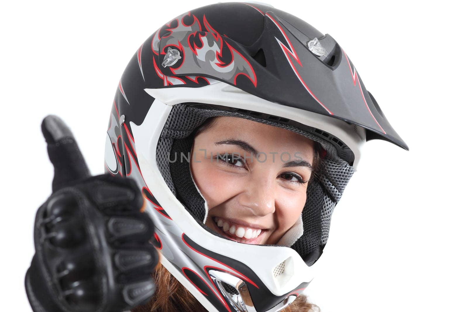 Happy biker woman with a motocross helmet and thumb up isolated on a white background