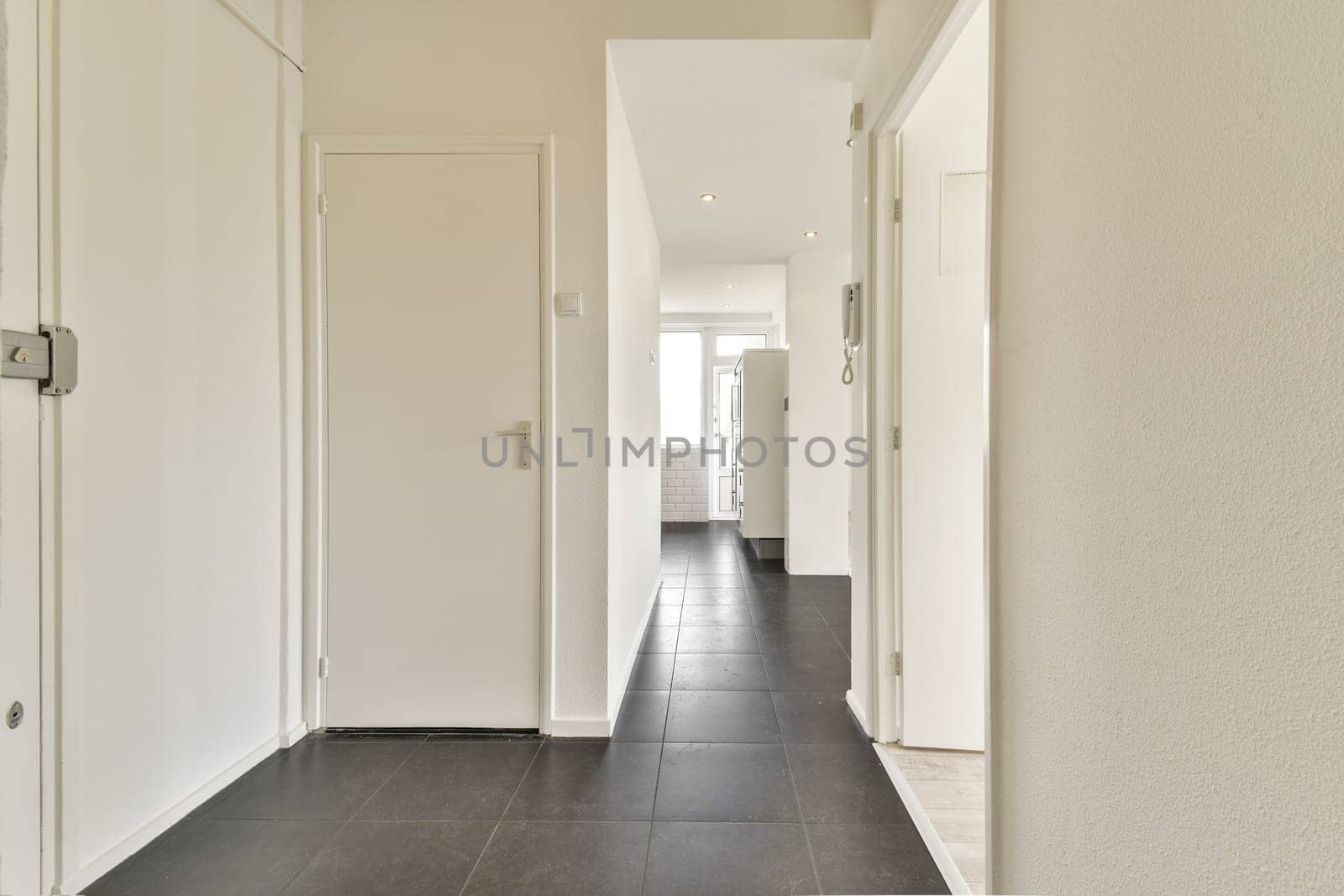 A sleek and modern interior hallway featuring clean lines, white walls, and a minimalist style. Ideal for contemporary home decor inspiration.