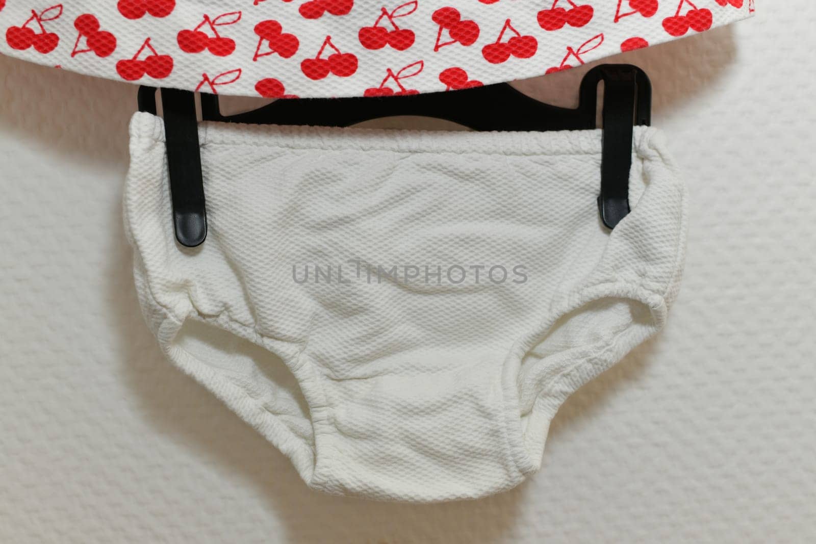 Dress cherry patterns with panties for girls on white background