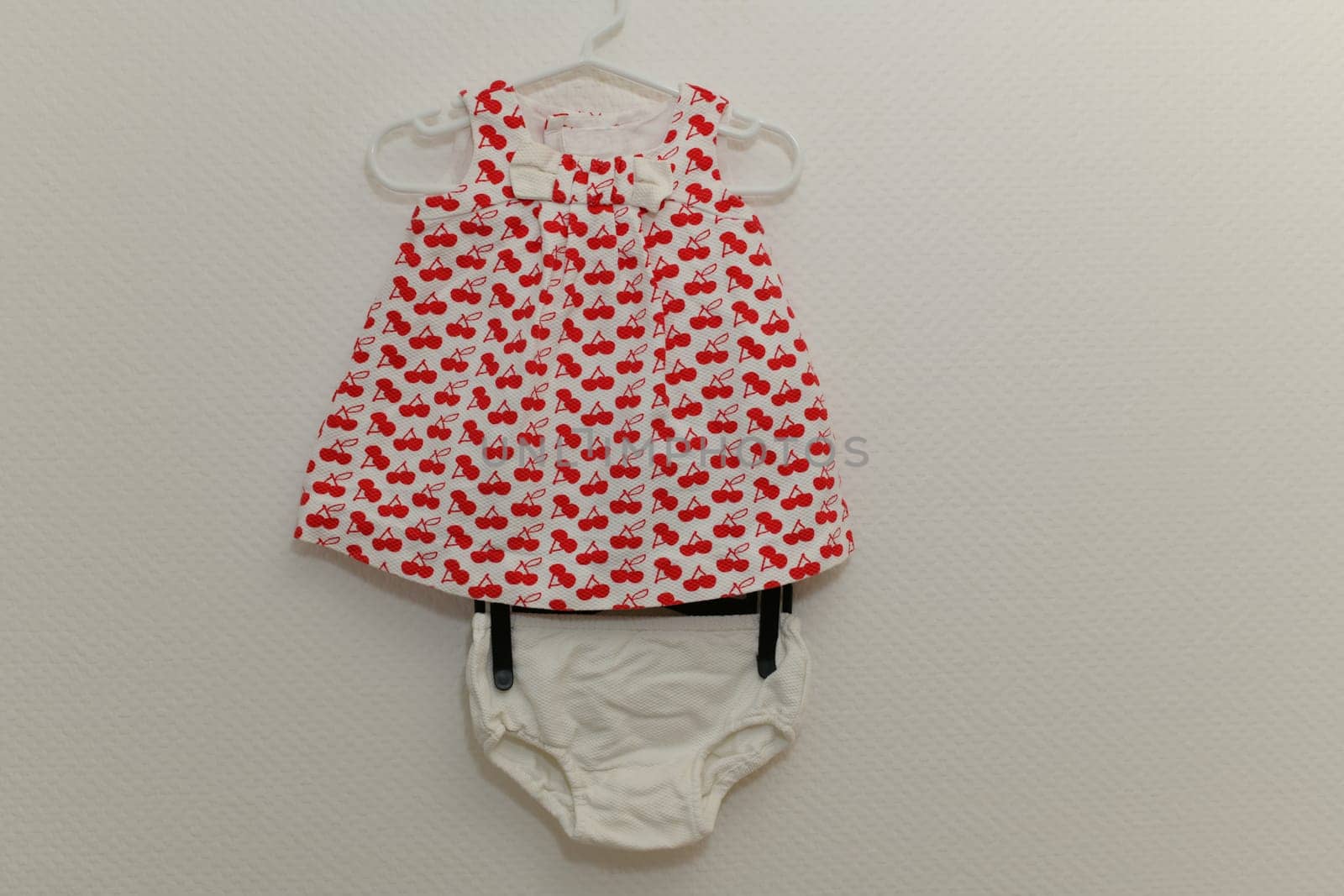 Dress cherry patterns with panties for girls on white background