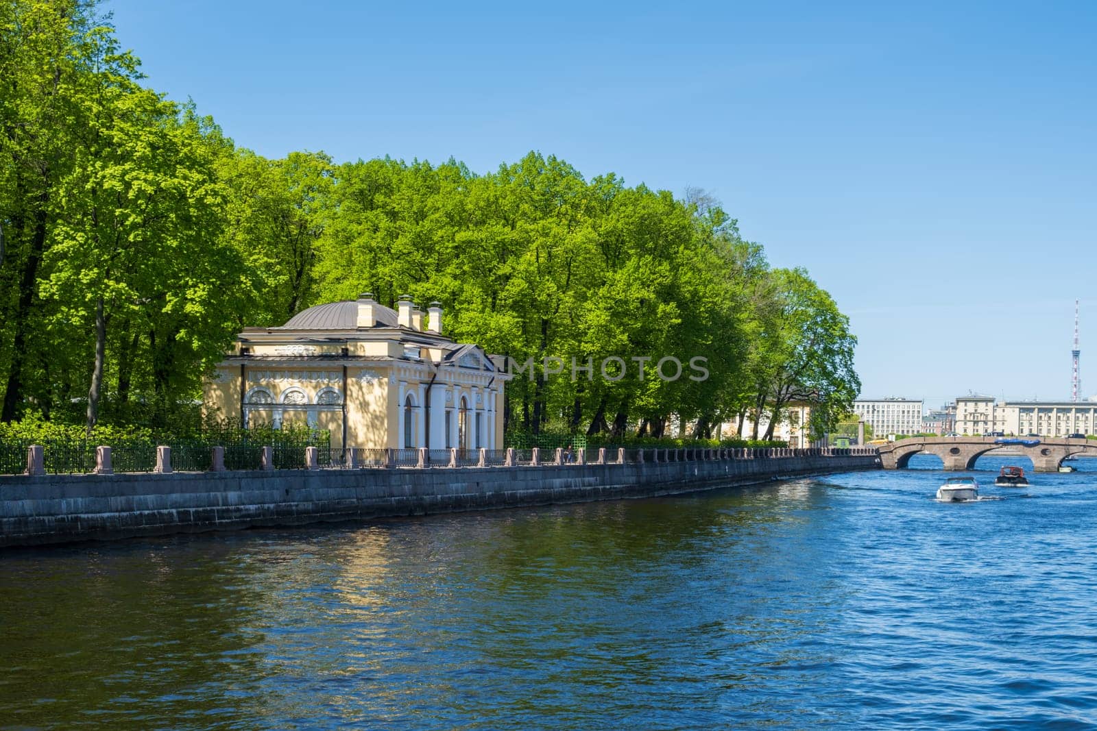 Saint-Petersburg, Russia - 05.21.24. Fontanka River with a pavilion surrounded by the greenery of the historic Summer Garden.