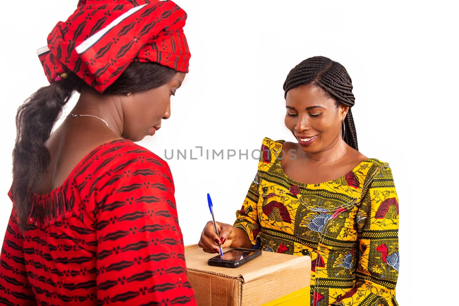 adult delivery service woman in red loincloth and female adult client signing her signature on digital mobile phone receiving mail box package in office
