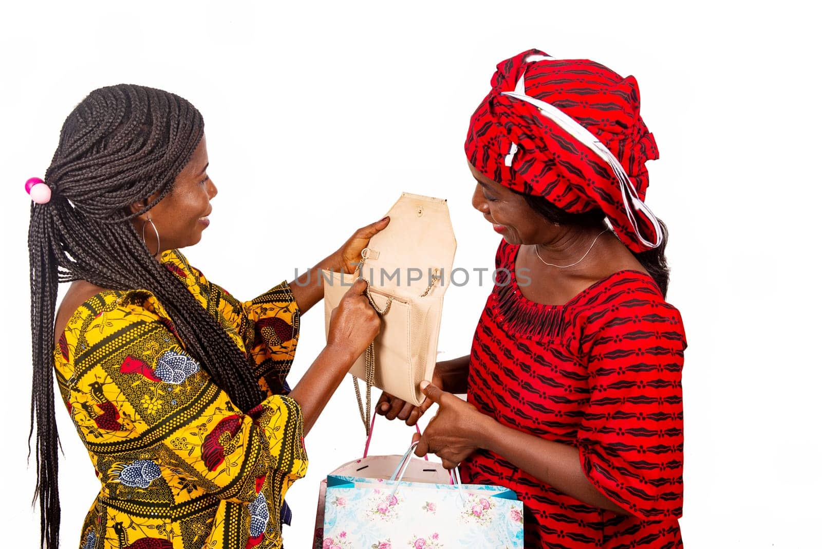 beautiful adult woman wearing a red loincloth holding shopping bags while the other woman opening her handbag
