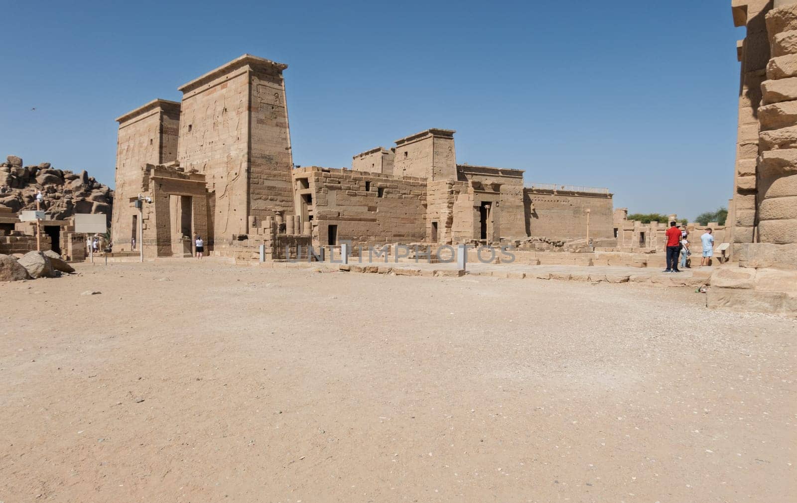 Side view of the reconstructed Philae Temple on an island in Aswan Harbor or Reservoir formed by the Low Dam on the Nile